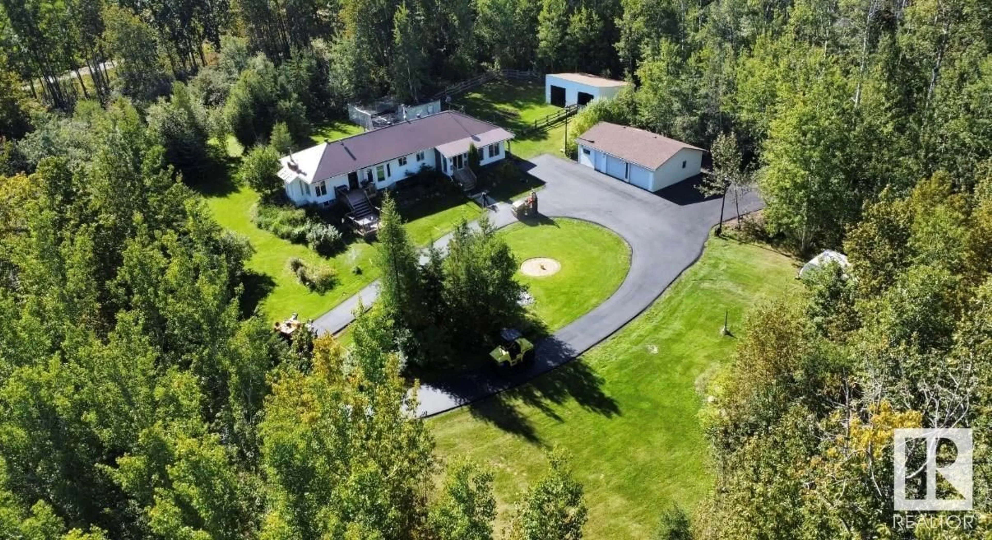 A pic from outside/outdoor area/front of a property/back of a property/a pic from drone, unknown for #4 - 54113 RGE ROAD 13, Rural Parkland County Alberta T7Y0J2