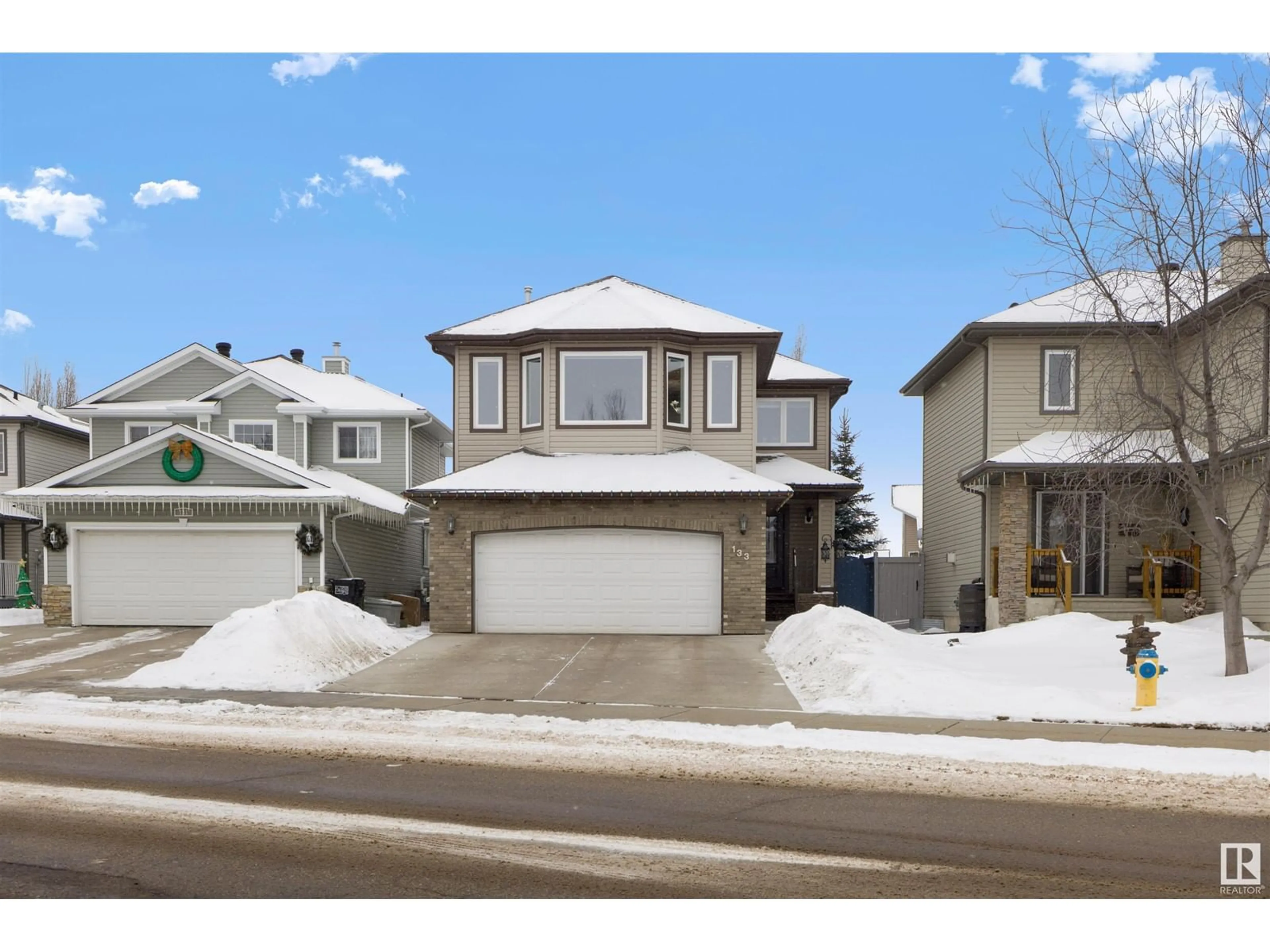 Home with vinyl exterior material, street for 133 CASTLE DR, Edmonton Alberta T5X6J1