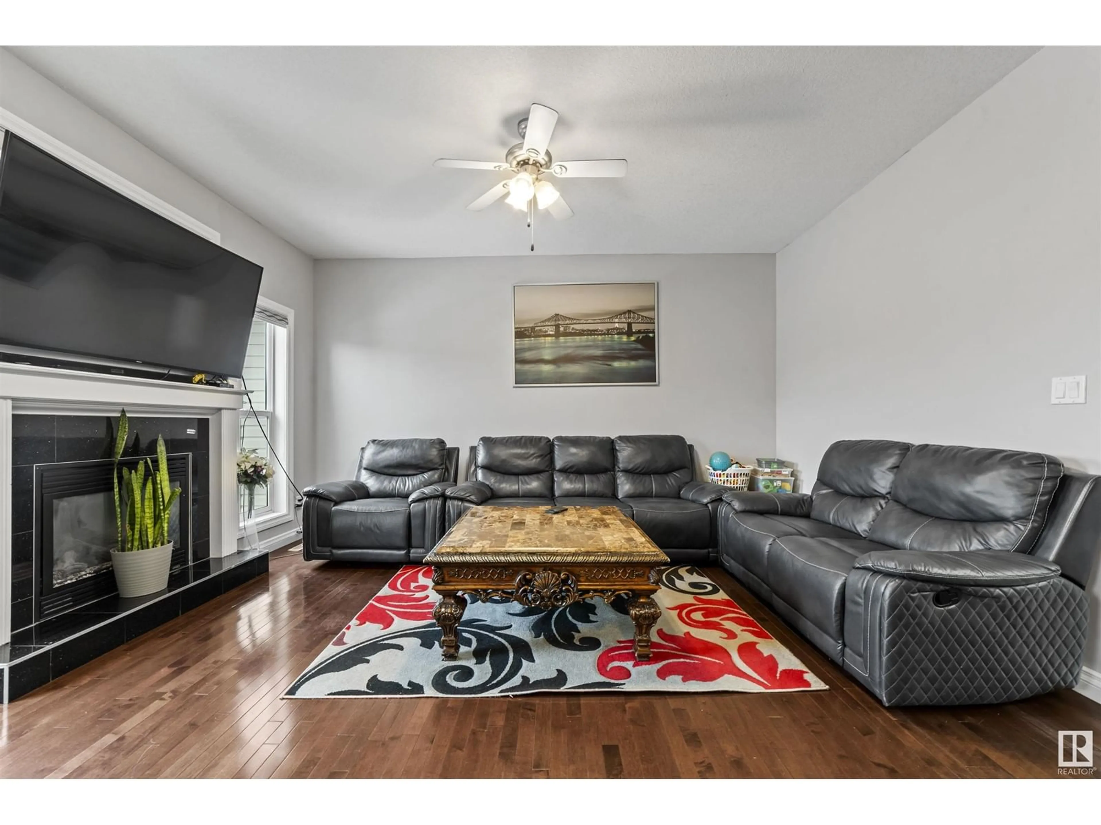 Living room with furniture, wood/laminate floor for NW - 2511 29 ST, Edmonton Alberta T6T0C8