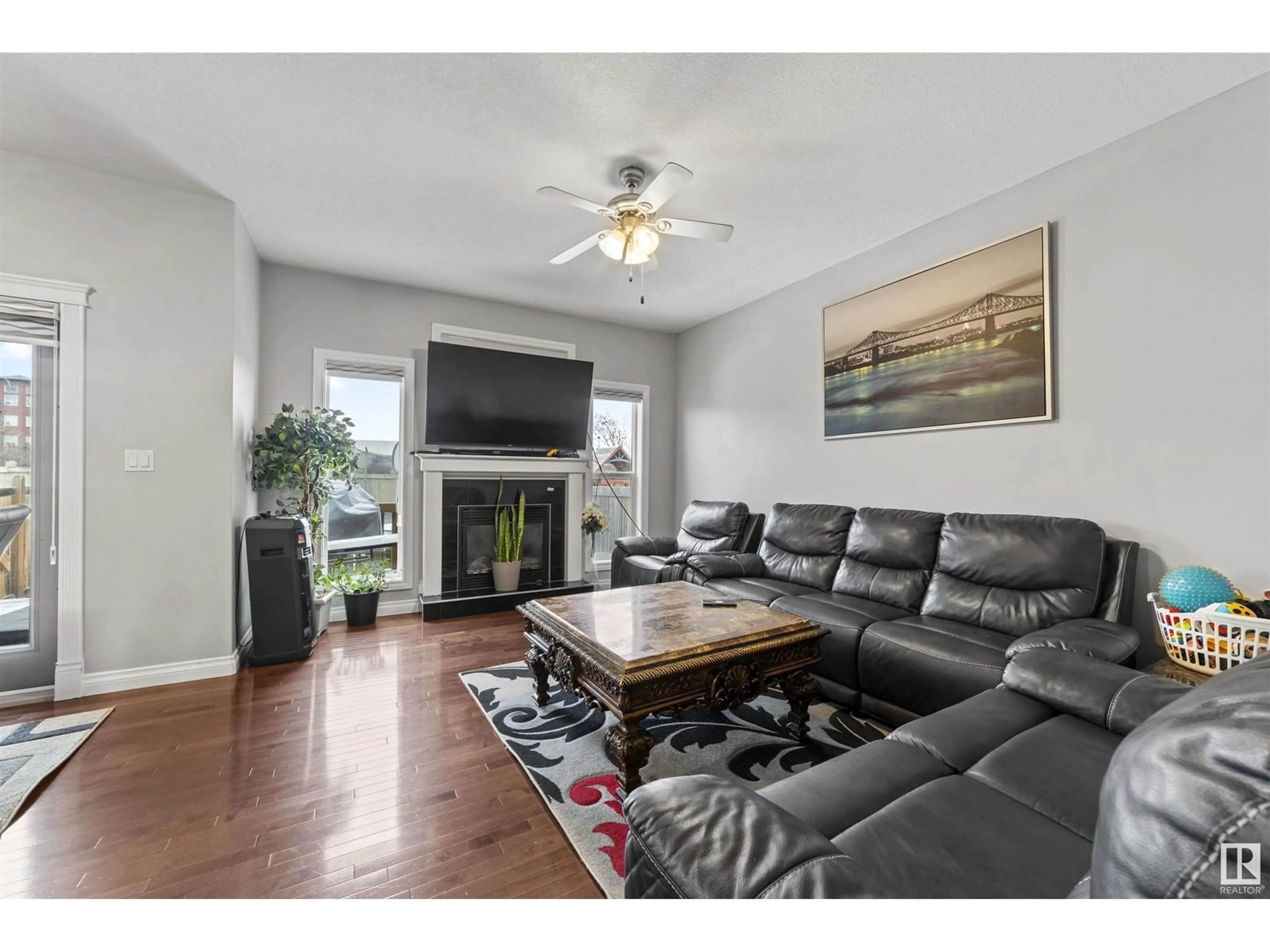 Living room with furniture, wood/laminate floor for NW - 2511 29 ST, Edmonton Alberta T6T0C8