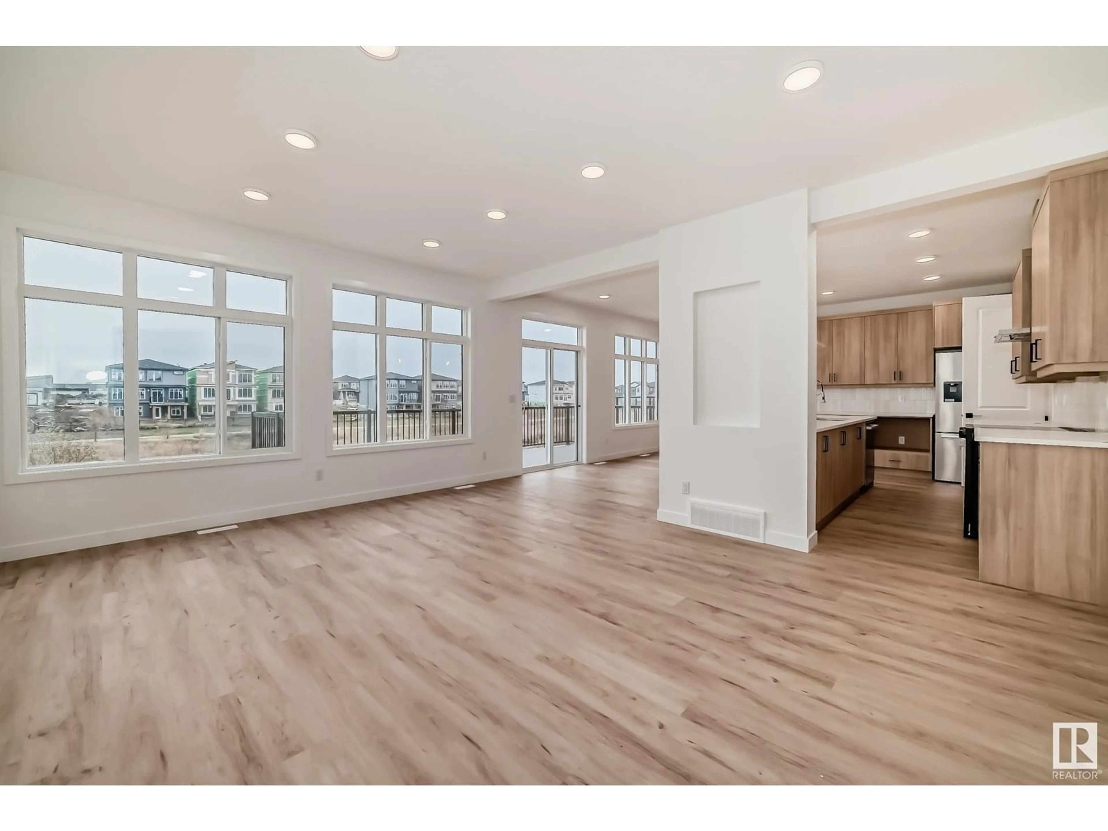 Open concept kitchen, wood/laminate floor for 5735 KOOTOOK WY, Edmonton Alberta T6W4V9