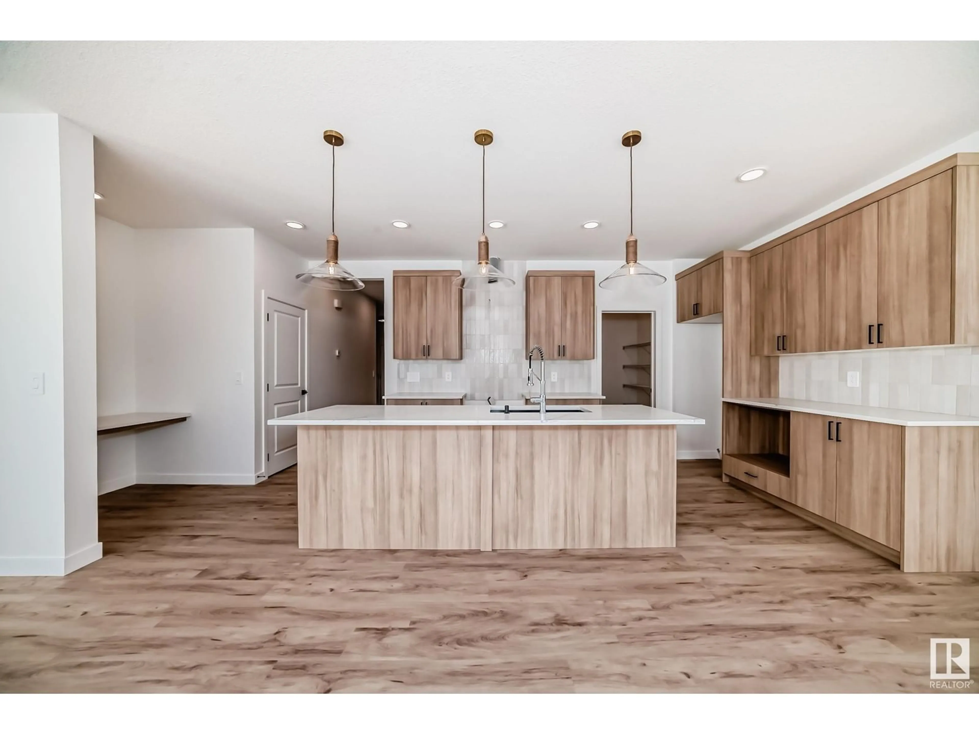 Open concept kitchen, wood/laminate floor for SW - 8215 KIRIAK LO, Edmonton Alberta T6W5S2