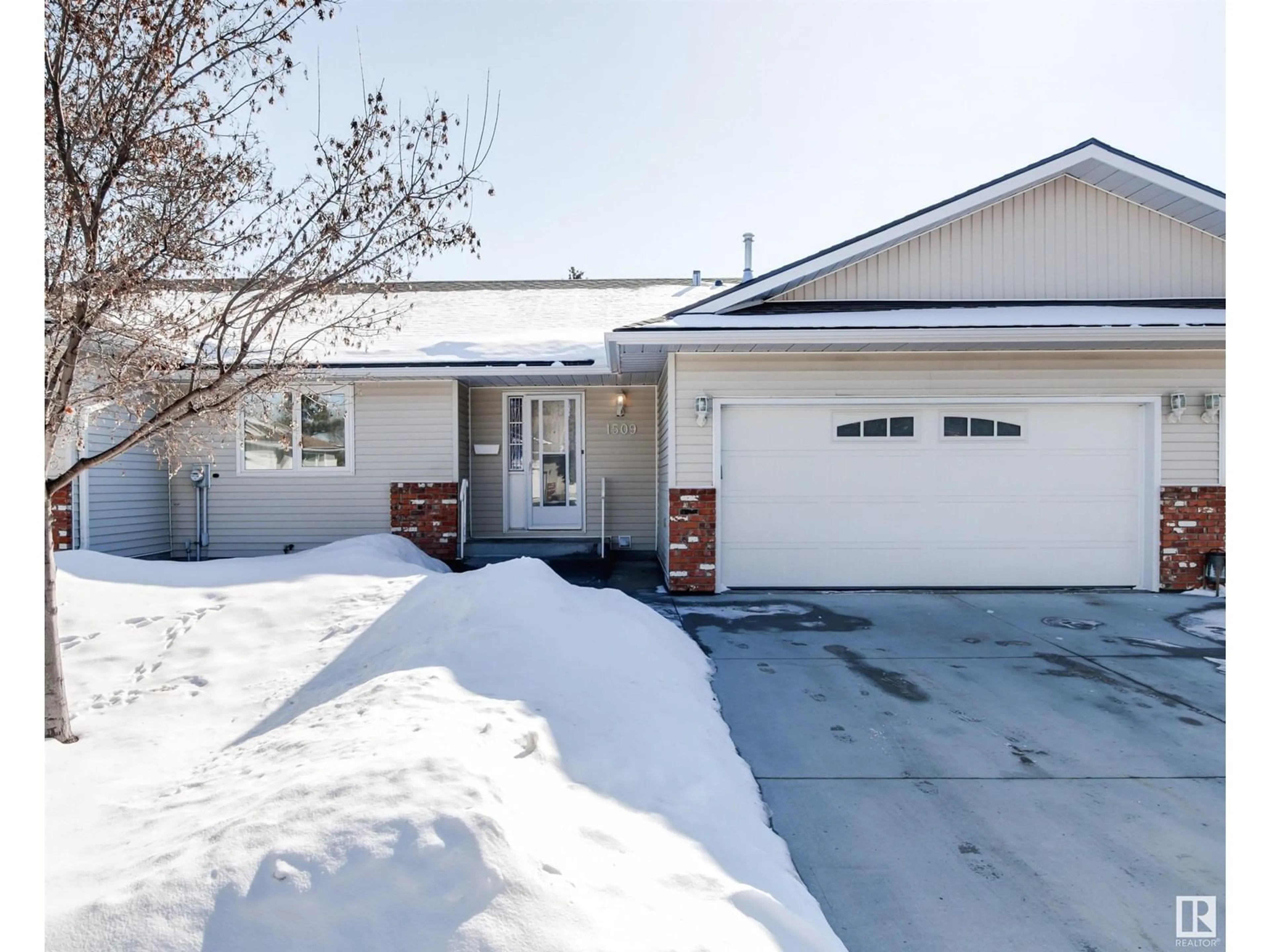 Home with vinyl exterior material, street for NW - 1509 62 ST, Edmonton Alberta T6L6J4