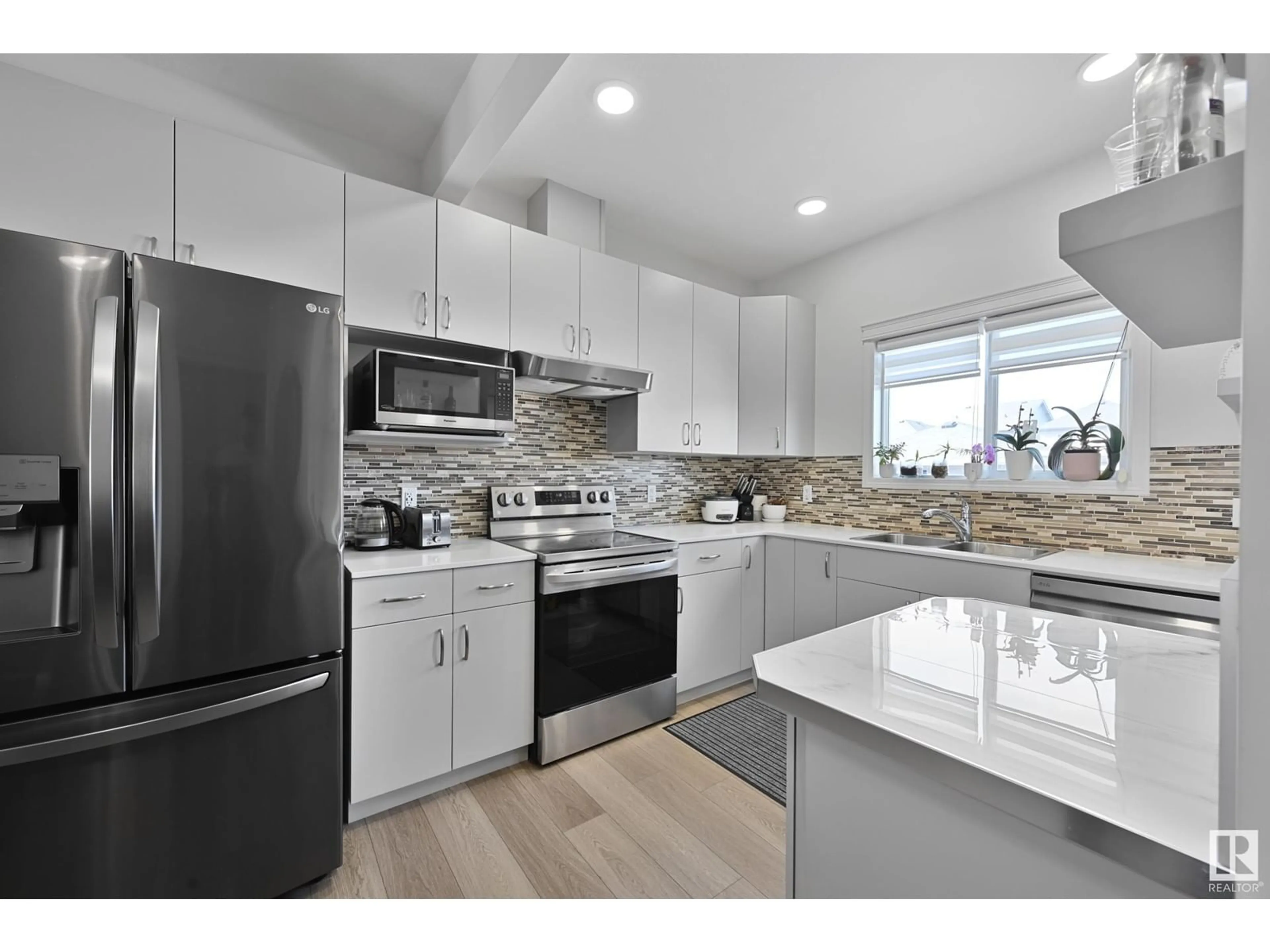 Open concept kitchen, ceramic/tile floor for NW - 17716 63 ST, Edmonton Alberta T5Y3C5