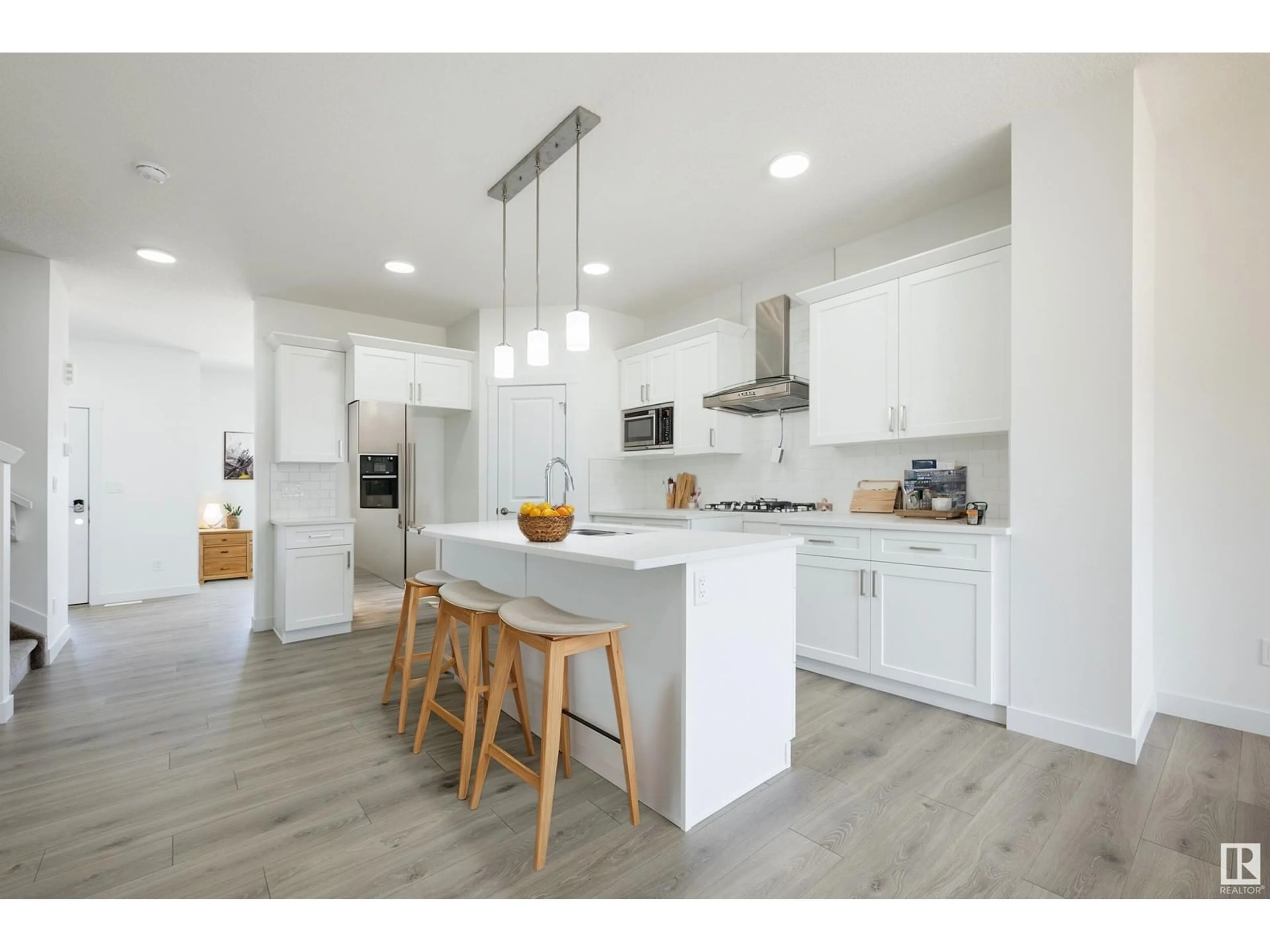 Open concept kitchen, wood/laminate floor for 57 COVELL CM, Spruce Grove Alberta T7X0Y7