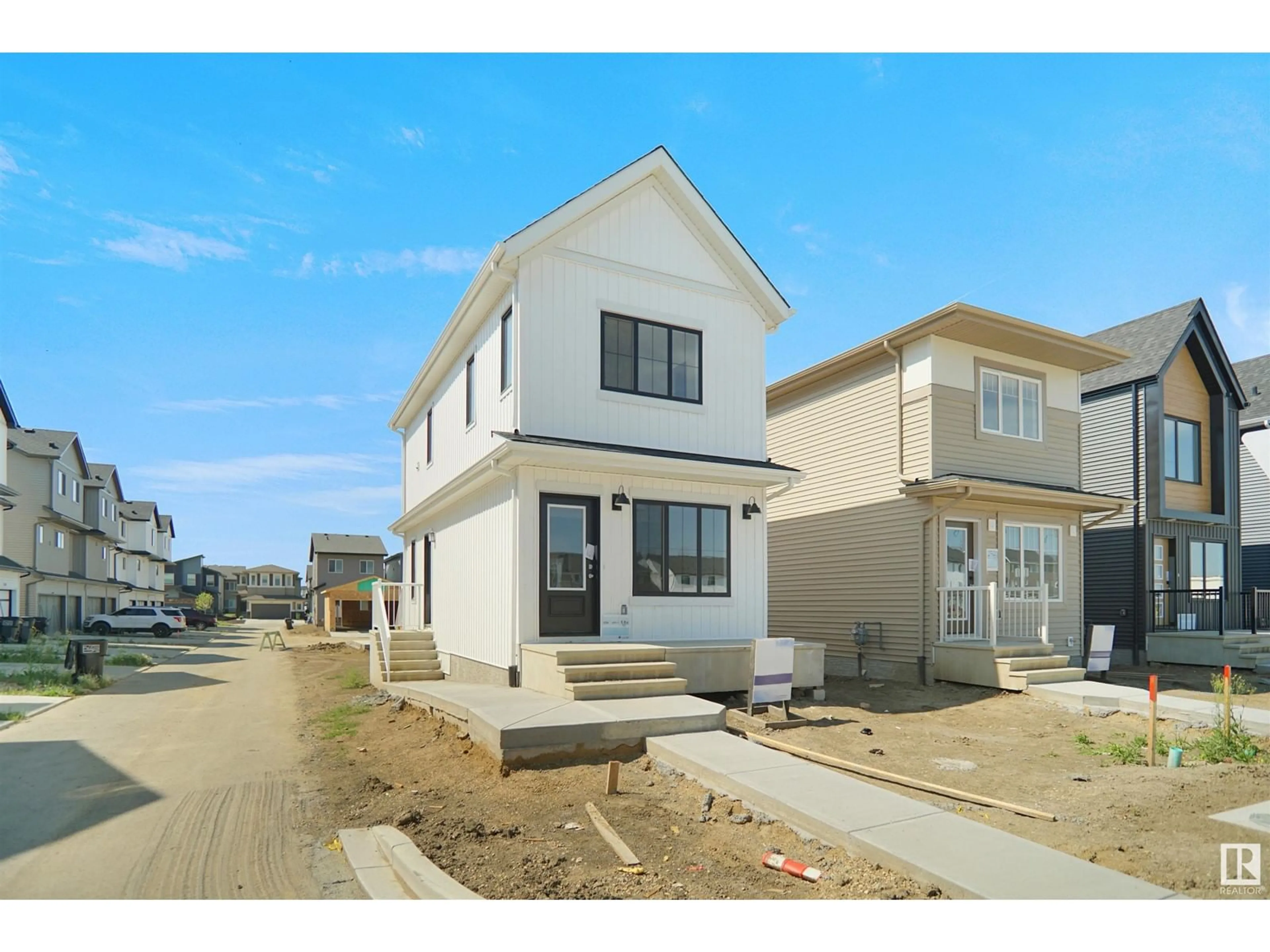 Home with vinyl exterior material, street for NW - 2039 210 ST, Edmonton Alberta T6M3H6