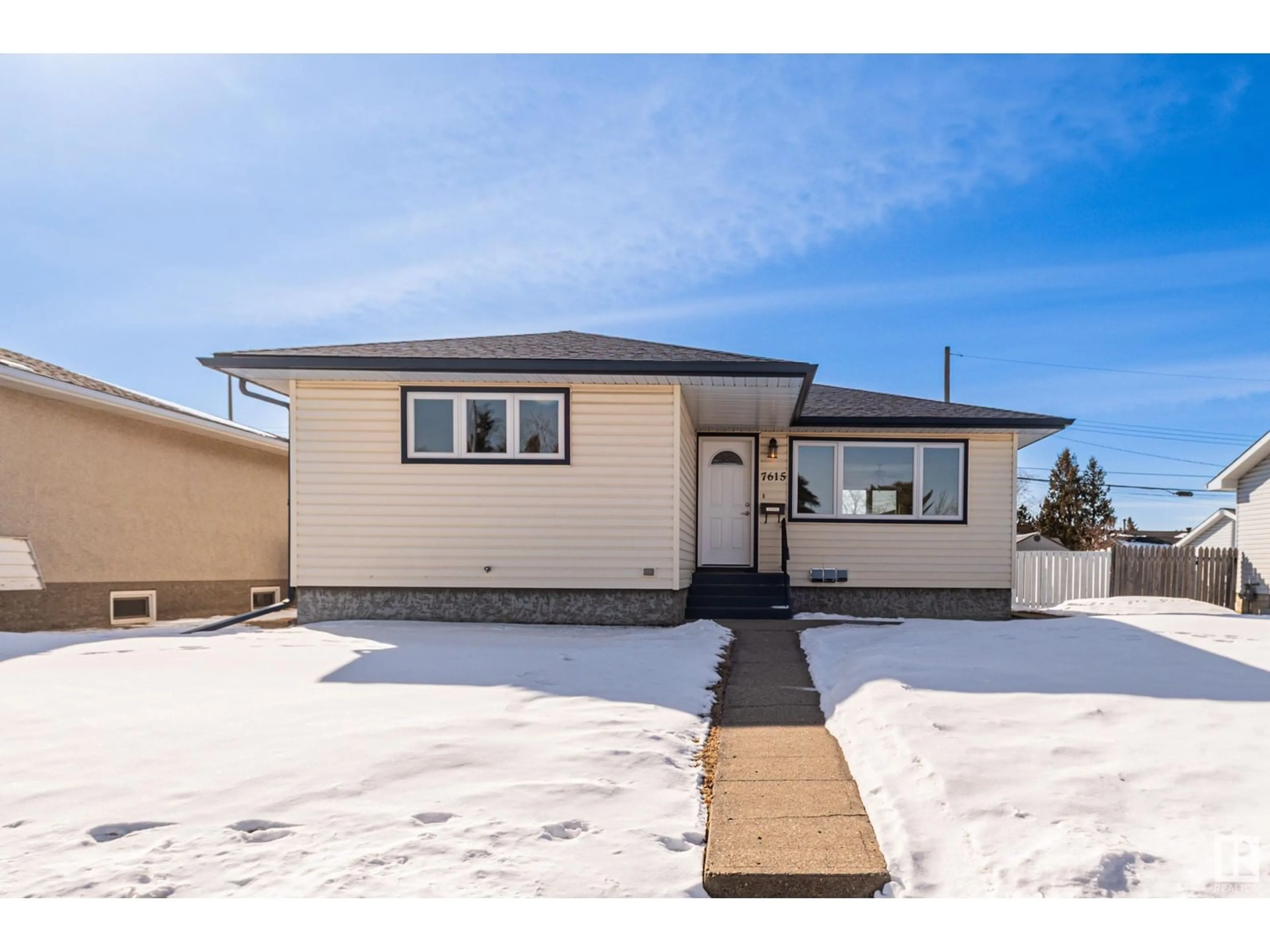 Home with vinyl exterior material, street for 7615 132 AV NW, Edmonton Alberta T5C2B2