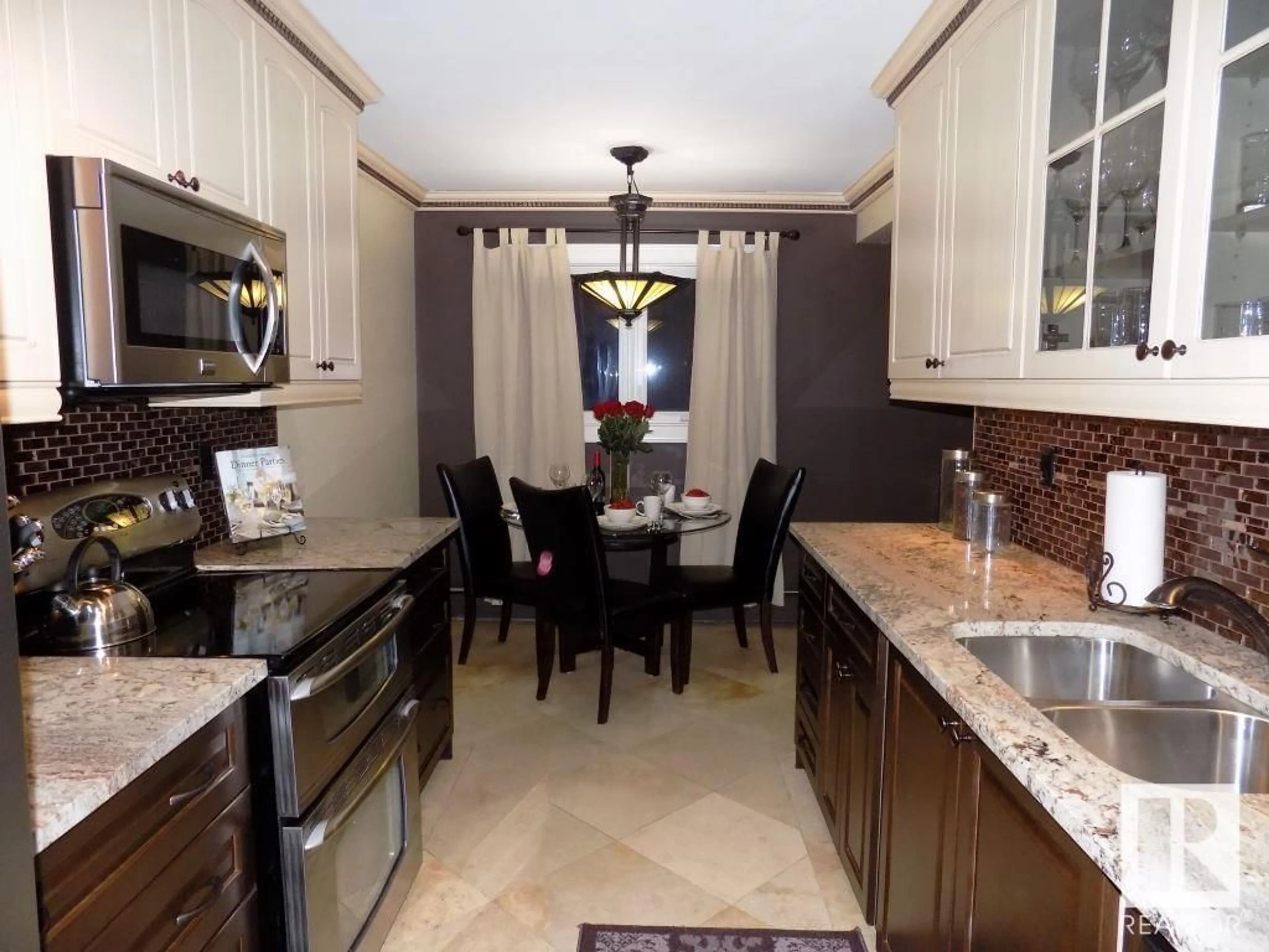 Open concept kitchen, ceramic/tile floor for 10735 81 AV, Edmonton Alberta T6E1Y2