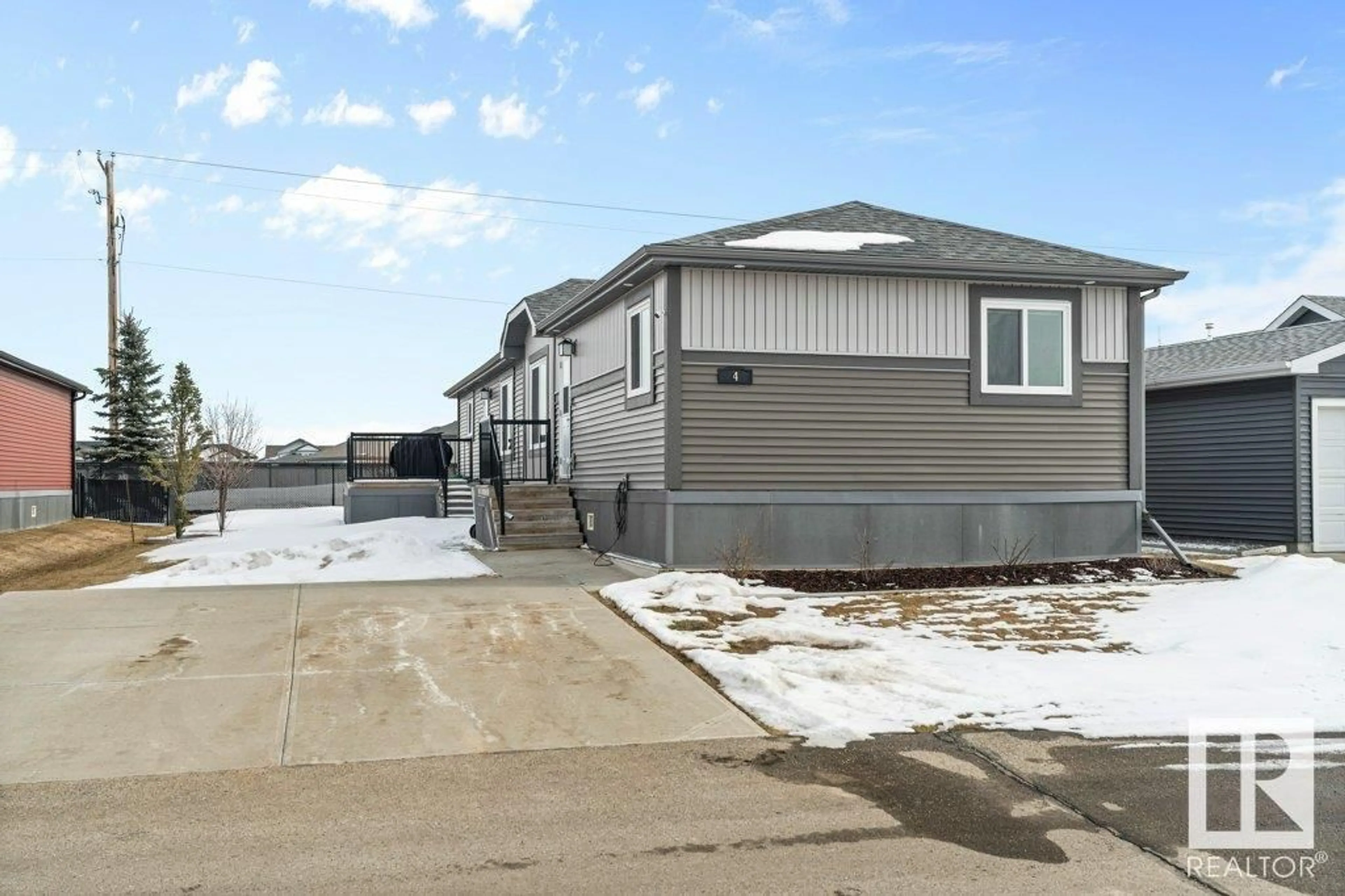 Home with vinyl exterior material, street for 4 ASPEN AV, Morinville Alberta T8R2P7