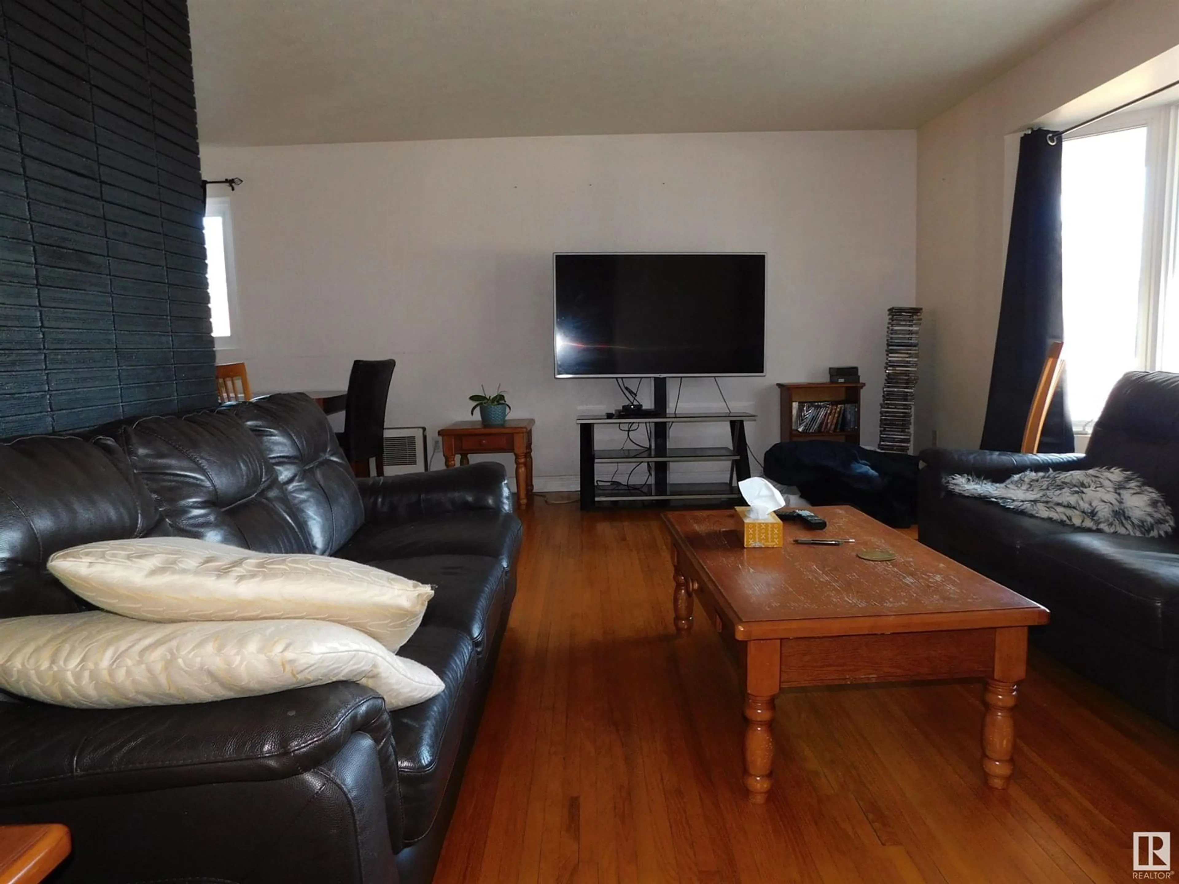 Living room with furniture, wood/laminate floor for NW - 12924 135A AV, Edmonton Alberta T5L3Z7