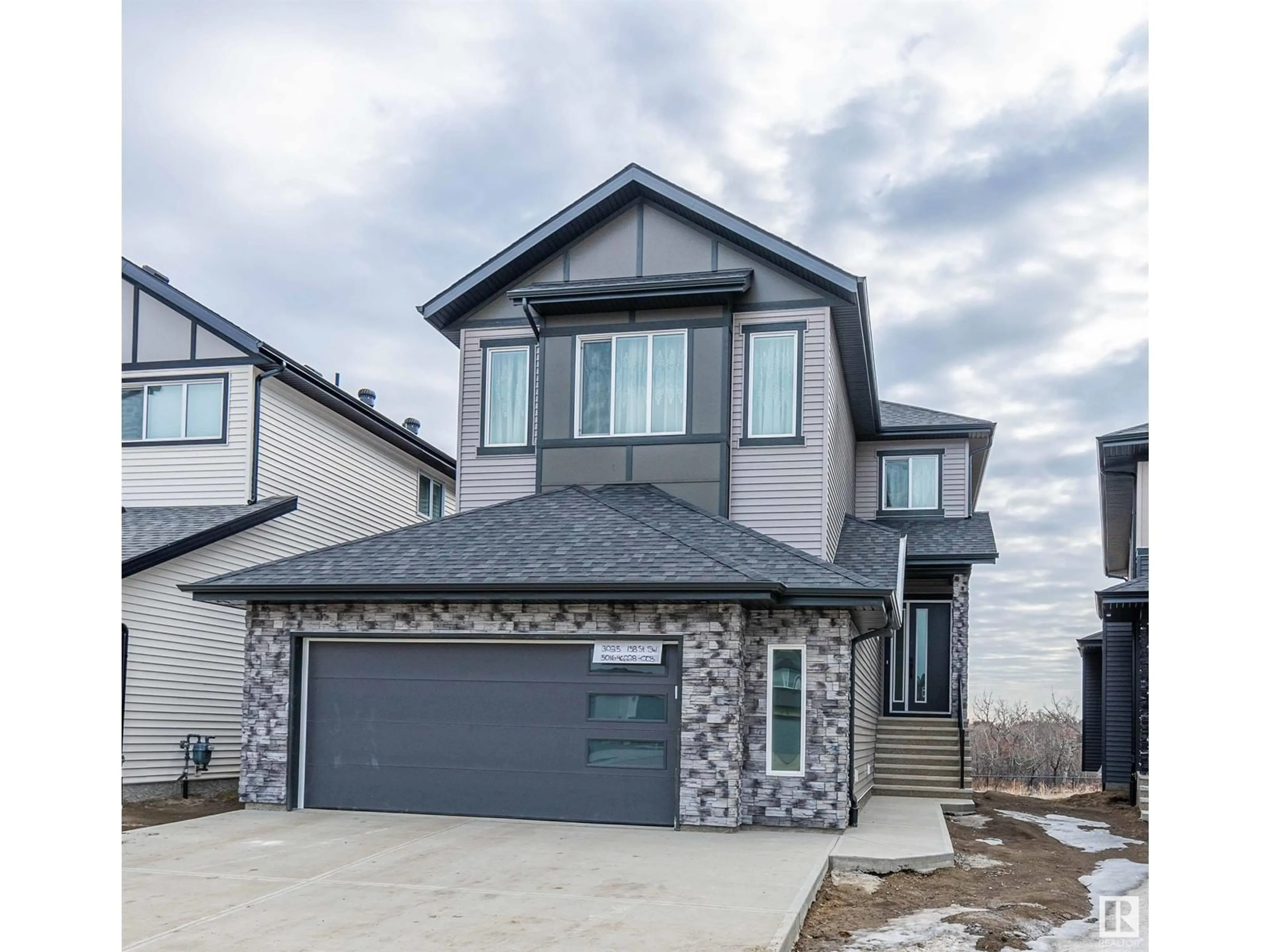 Home with vinyl exterior material, street for SW - 3035 158 ST, Edmonton Alberta T6W5H5
