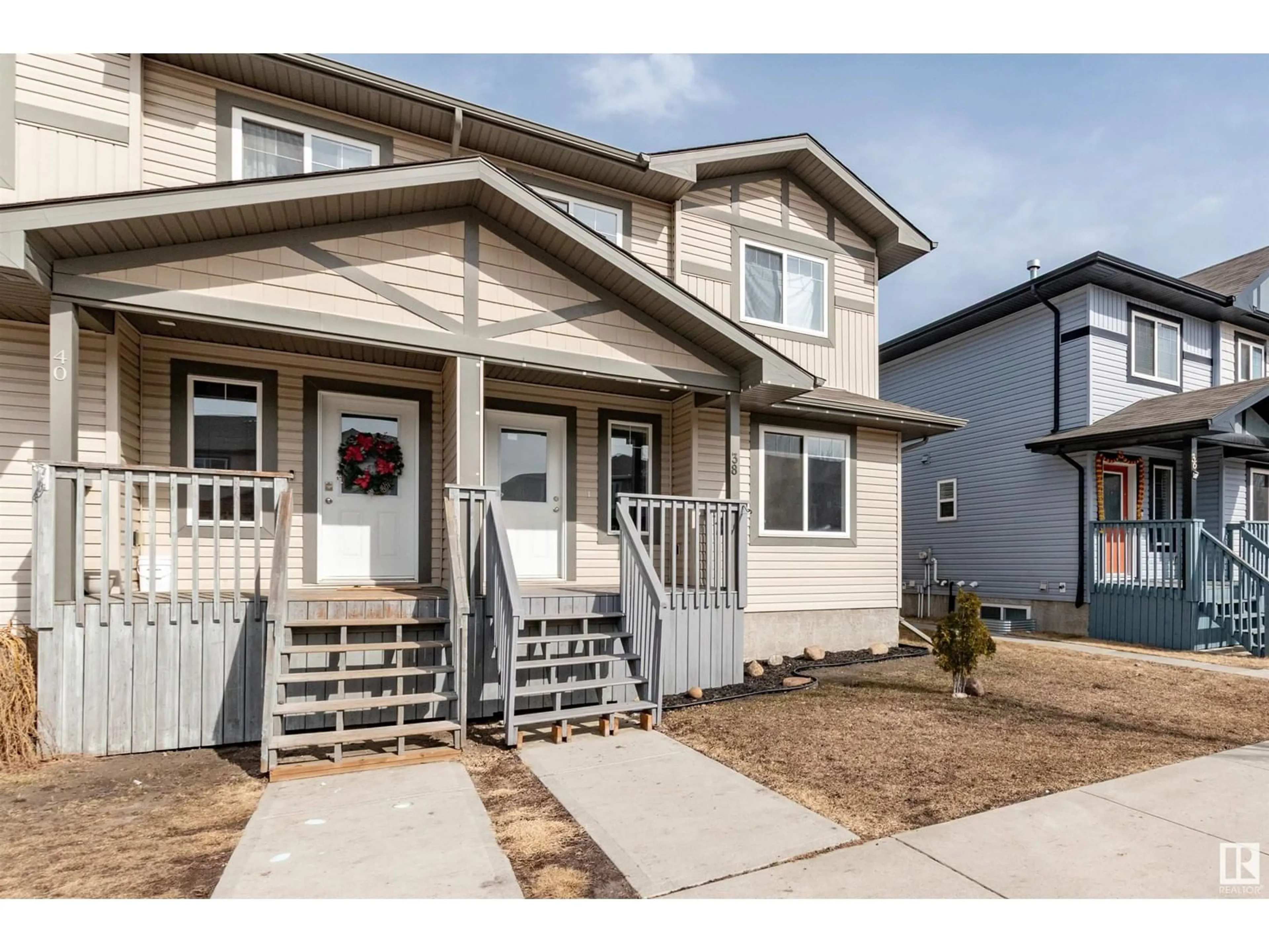 Home with vinyl exterior material, street for 38 ROSEBERRY LN, Fort Saskatchewan Alberta T8L0M6