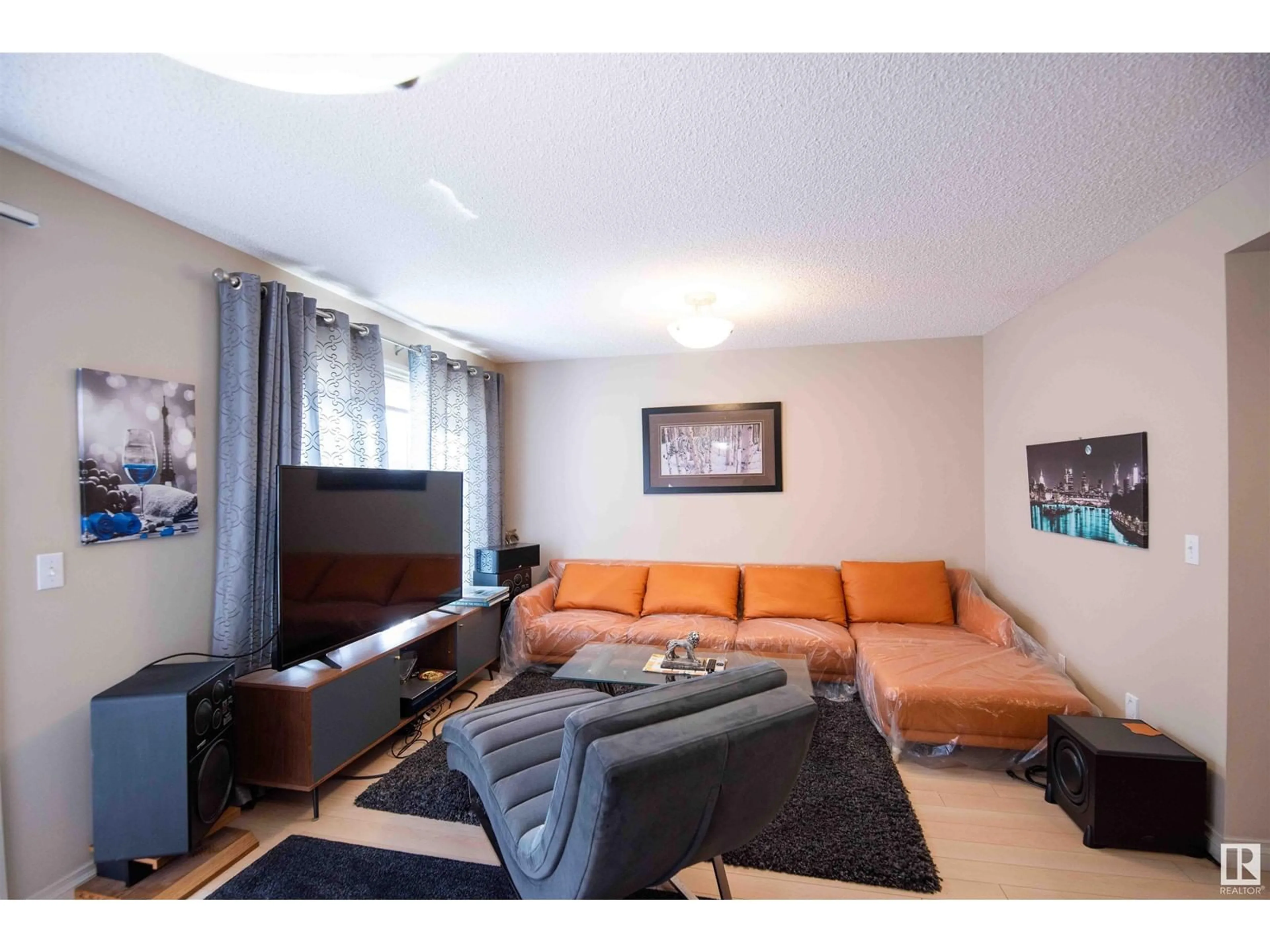 Living room with furniture, wood/laminate floor for #57 - 2005 70 ST, Edmonton Alberta T6X0T9