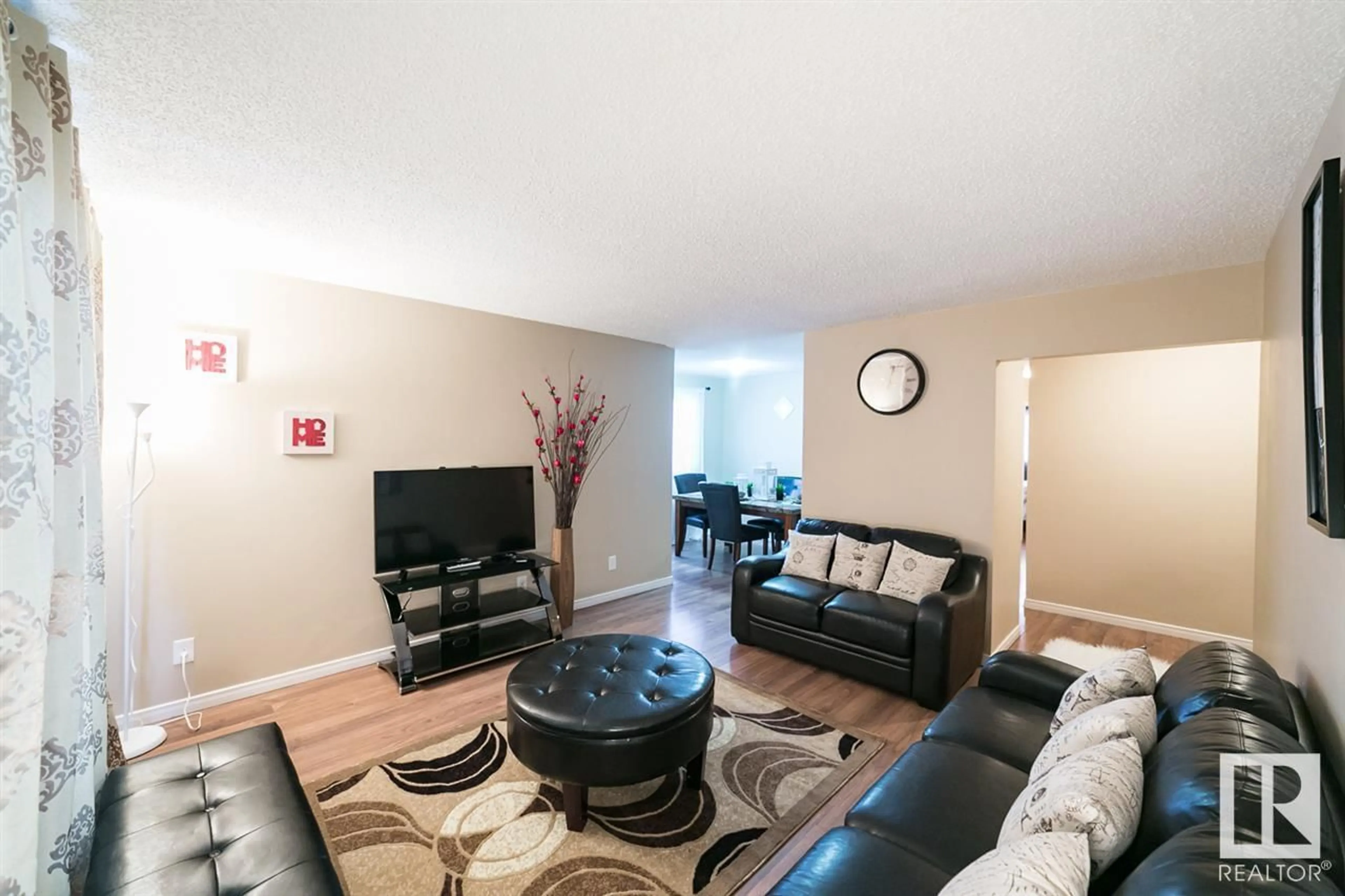 Living room with furniture, wood/laminate floor for 13853 114 ST, Edmonton Alberta T5X4A1