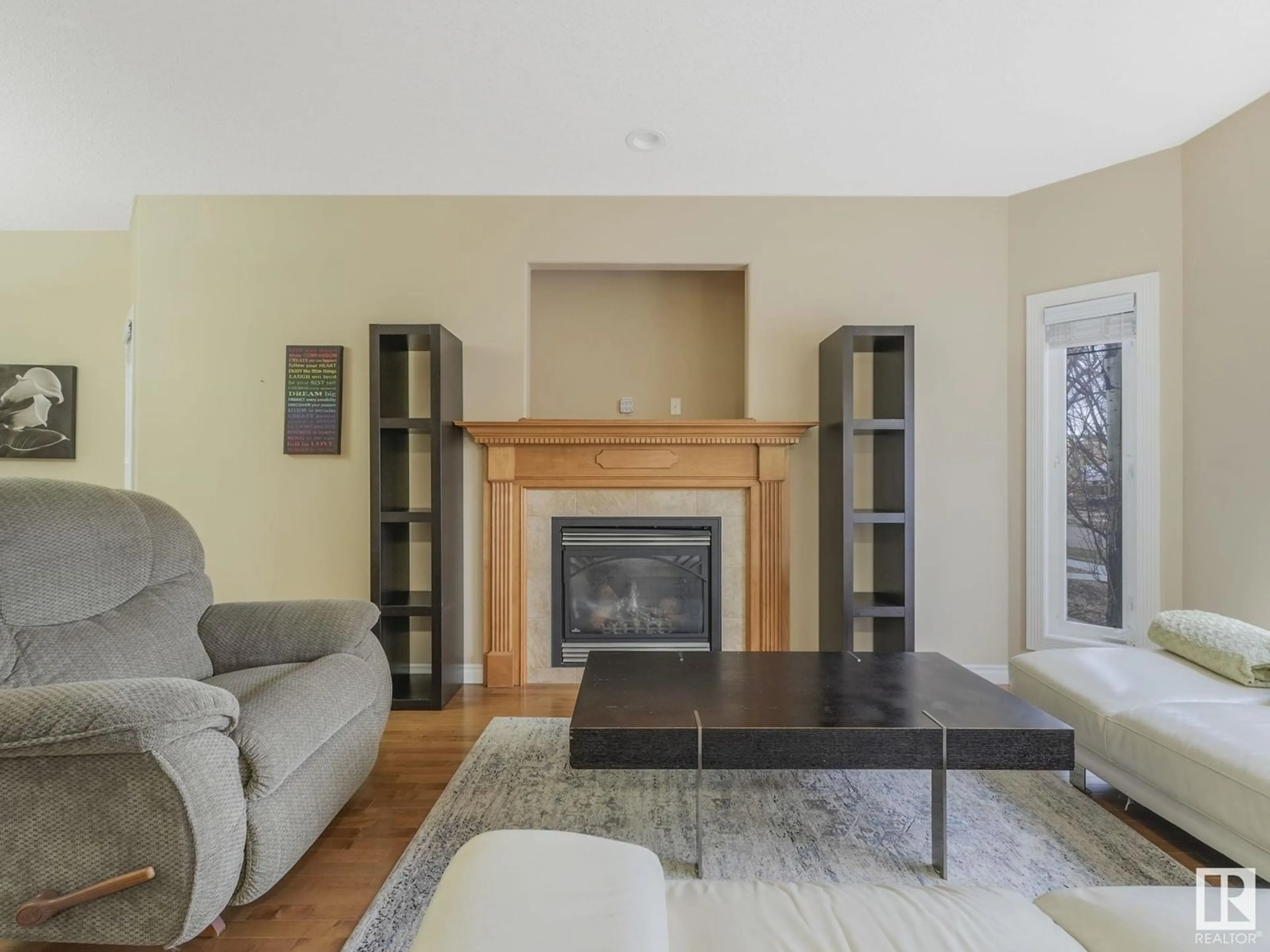 Living room with furniture, wood/laminate floor for NW - 11720 126 ST, Edmonton Alberta T6M0S2