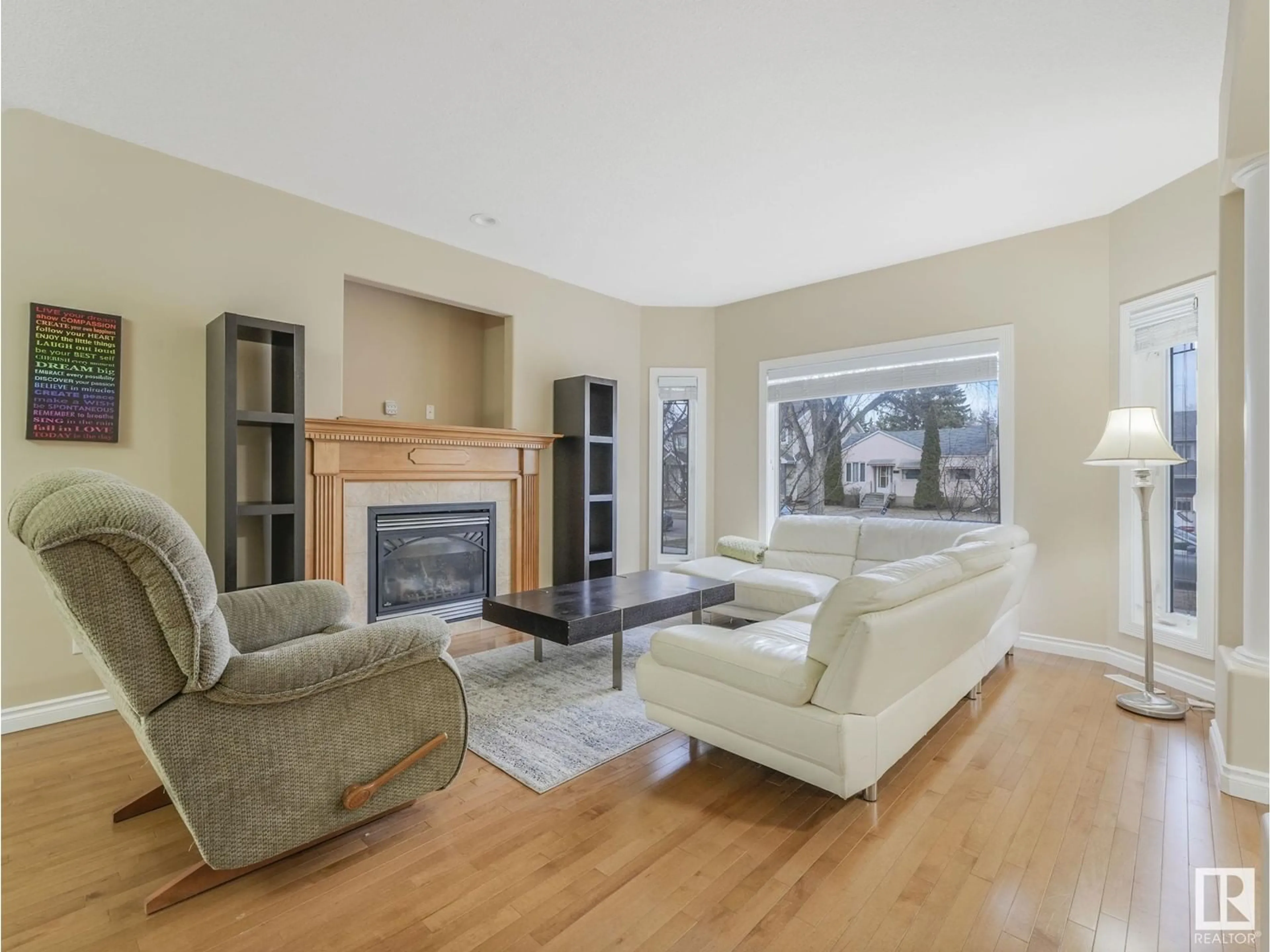Living room with furniture, wood/laminate floor for NW - 11720 126 ST, Edmonton Alberta T6M0S2