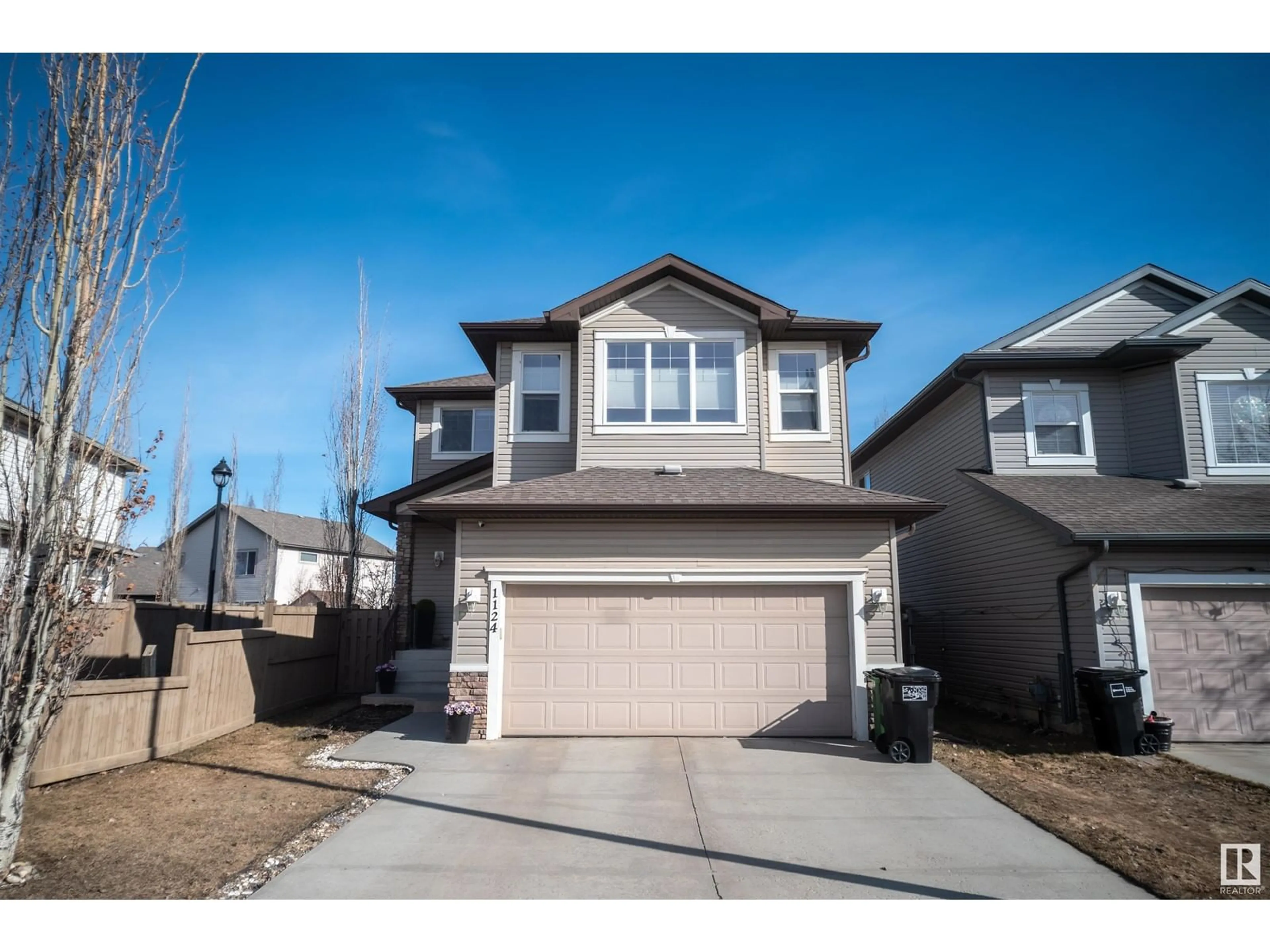 Home with vinyl exterior material, street for 1124 HAYS DR, Edmonton Alberta T6M0M2