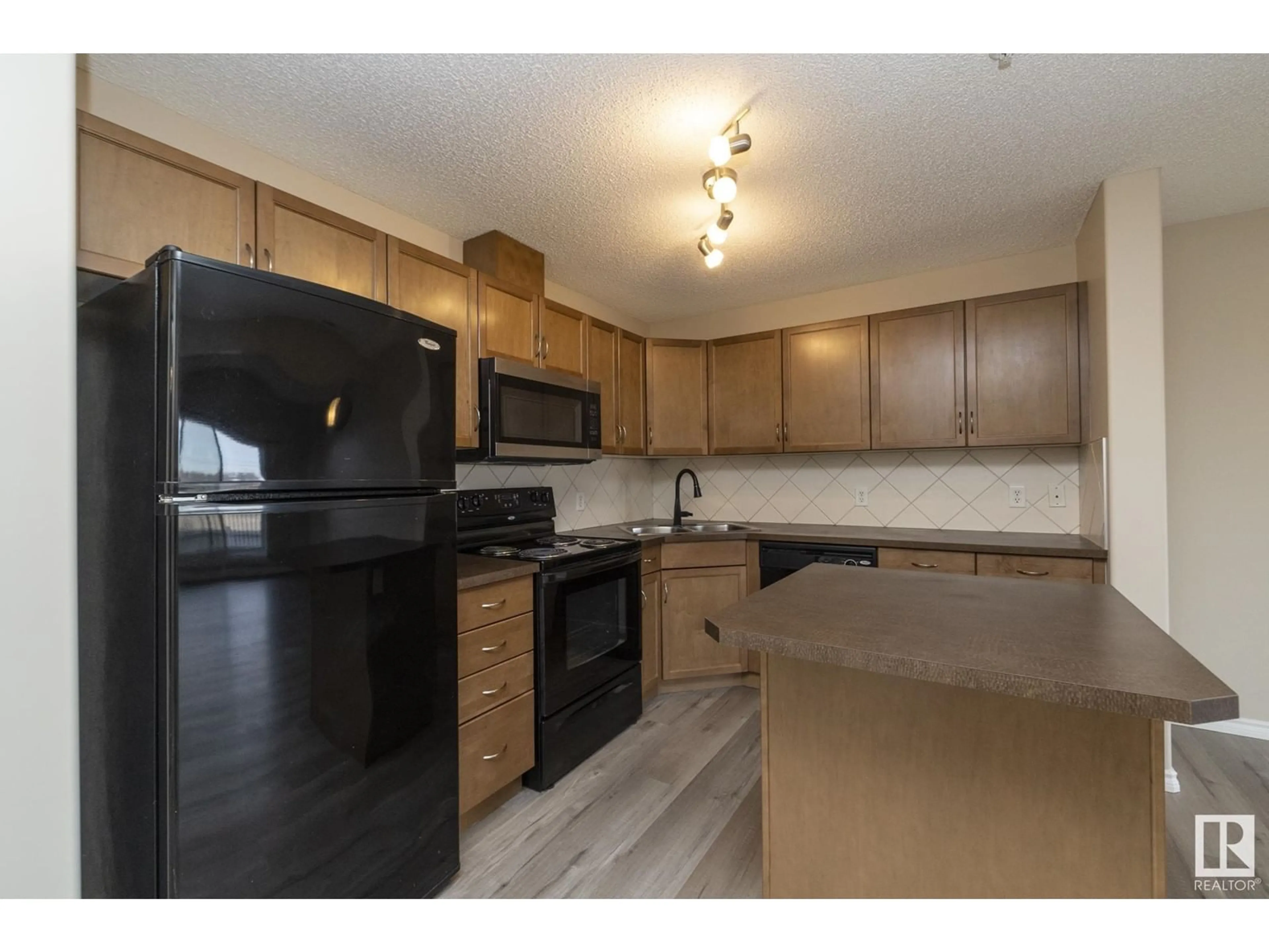 Standard kitchen, wood/laminate floor for 210 646 MCALLISTER LO SW, Edmonton Alberta T6W0B5