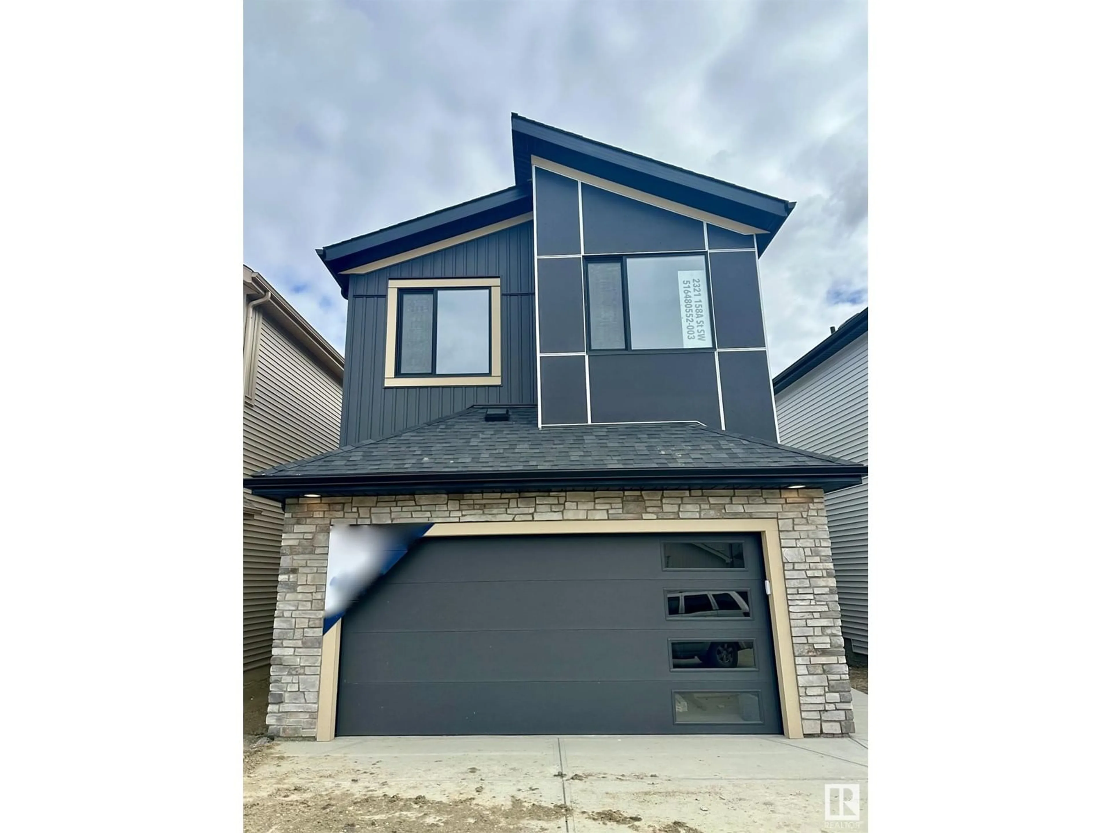 Open concept kitchen, wood/laminate floor for SW - 2321 158A ST, Edmonton Alberta T6W4L1