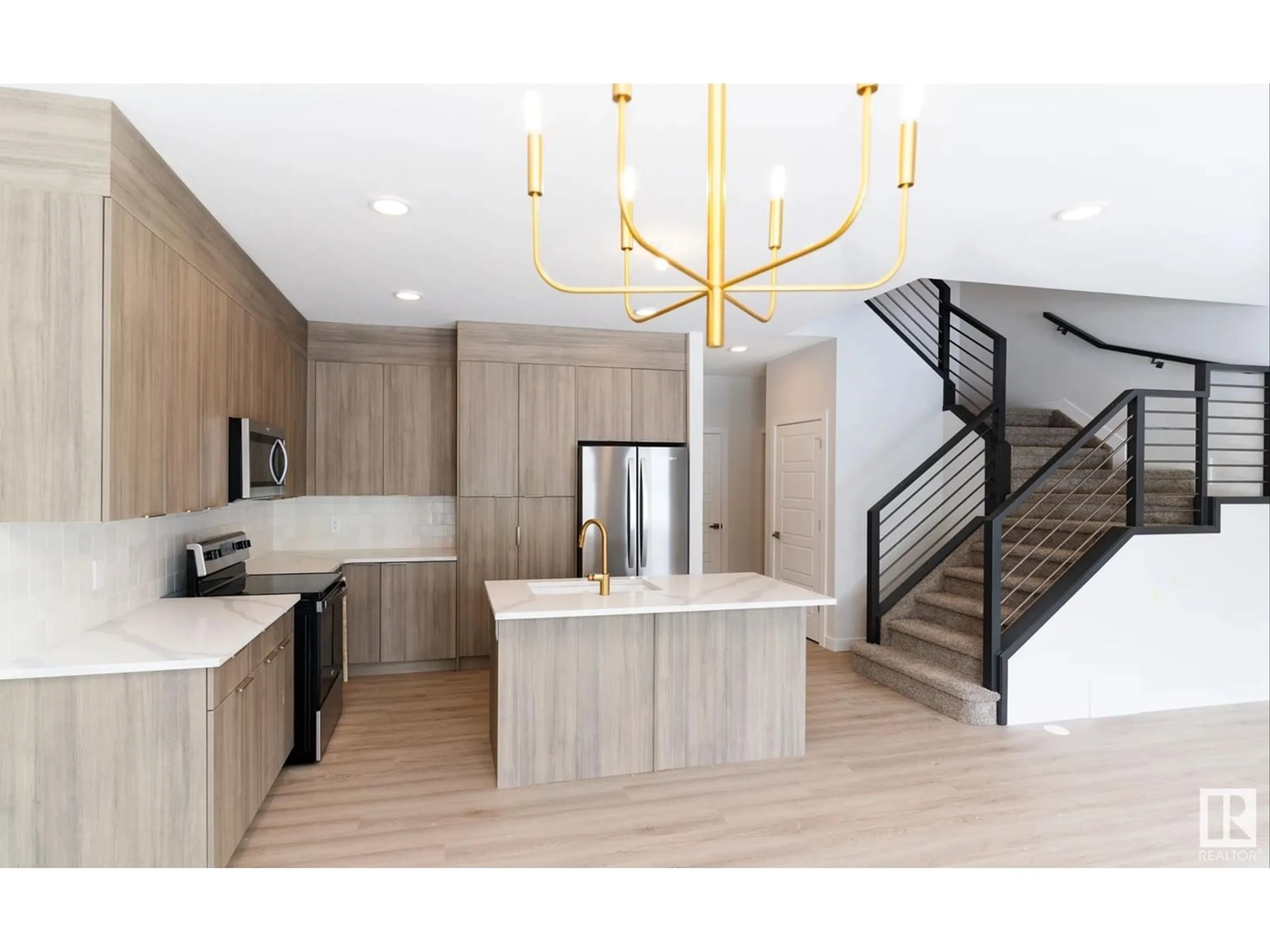 Open concept kitchen, wood/laminate floor for SW - 2321 158A ST, Edmonton Alberta T6W4L1