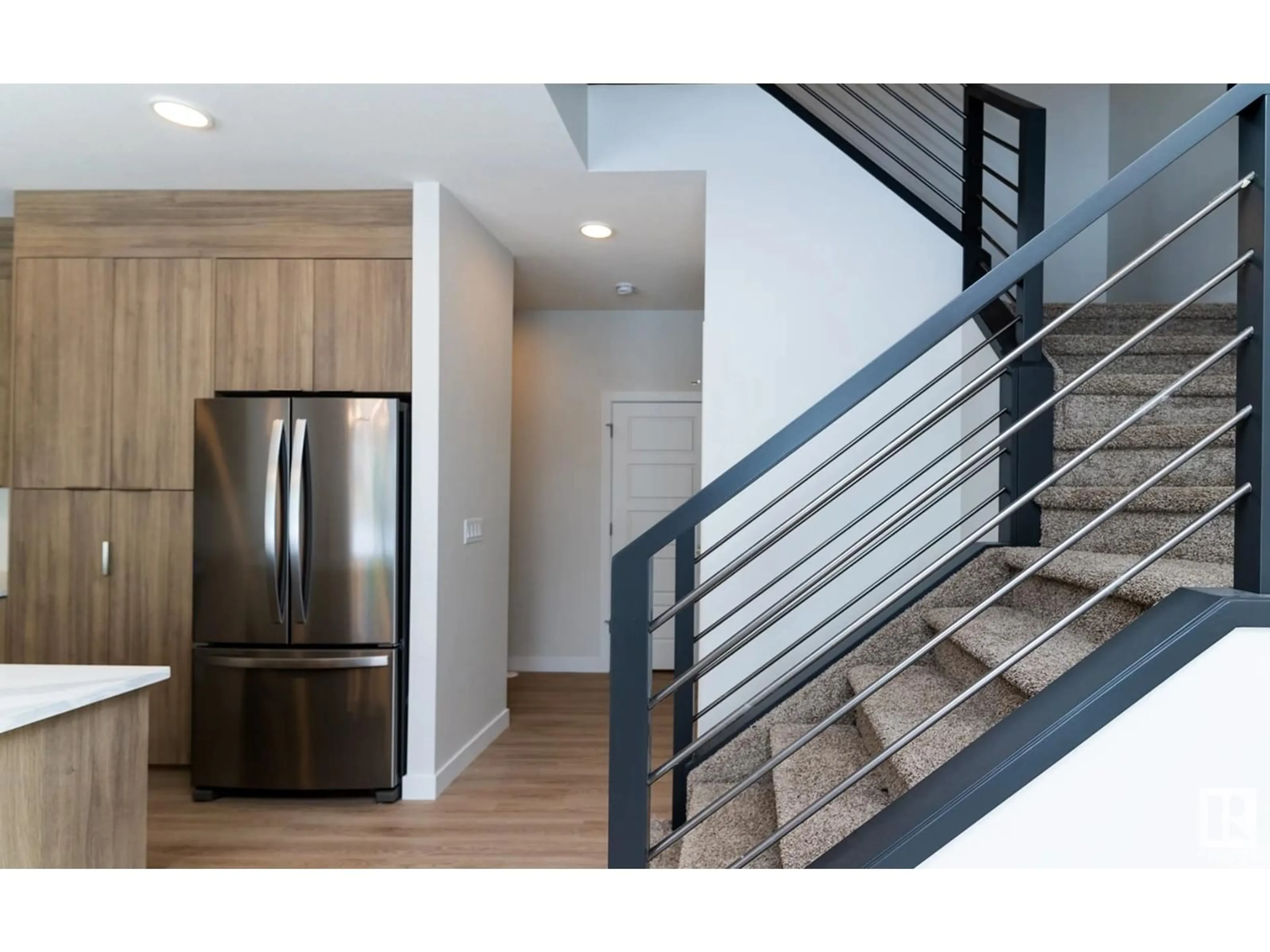 Open concept kitchen, wood/laminate floor for SW - 2321 158A ST, Edmonton Alberta T6W4L1