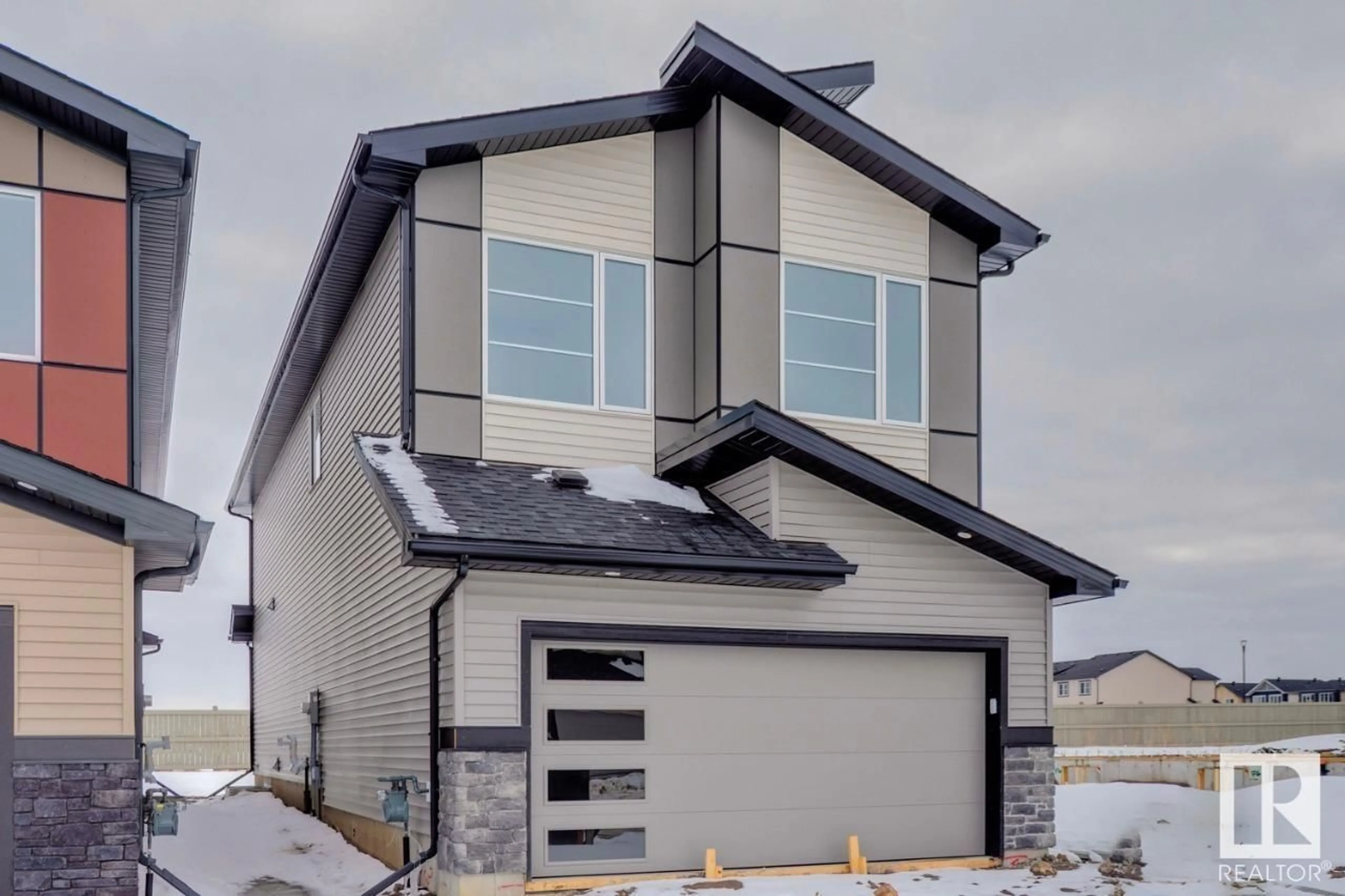 Home with vinyl exterior material, street for 7211 182 AV, Edmonton Alberta T5Z0J1
