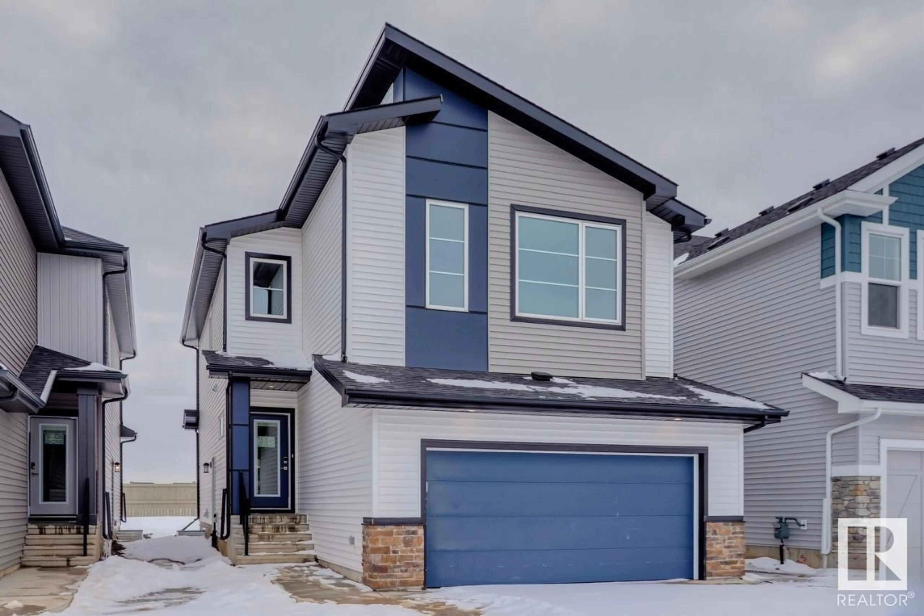 Home with vinyl exterior material, street for 7151 182 AV, Edmonton Alberta T5Z0J1