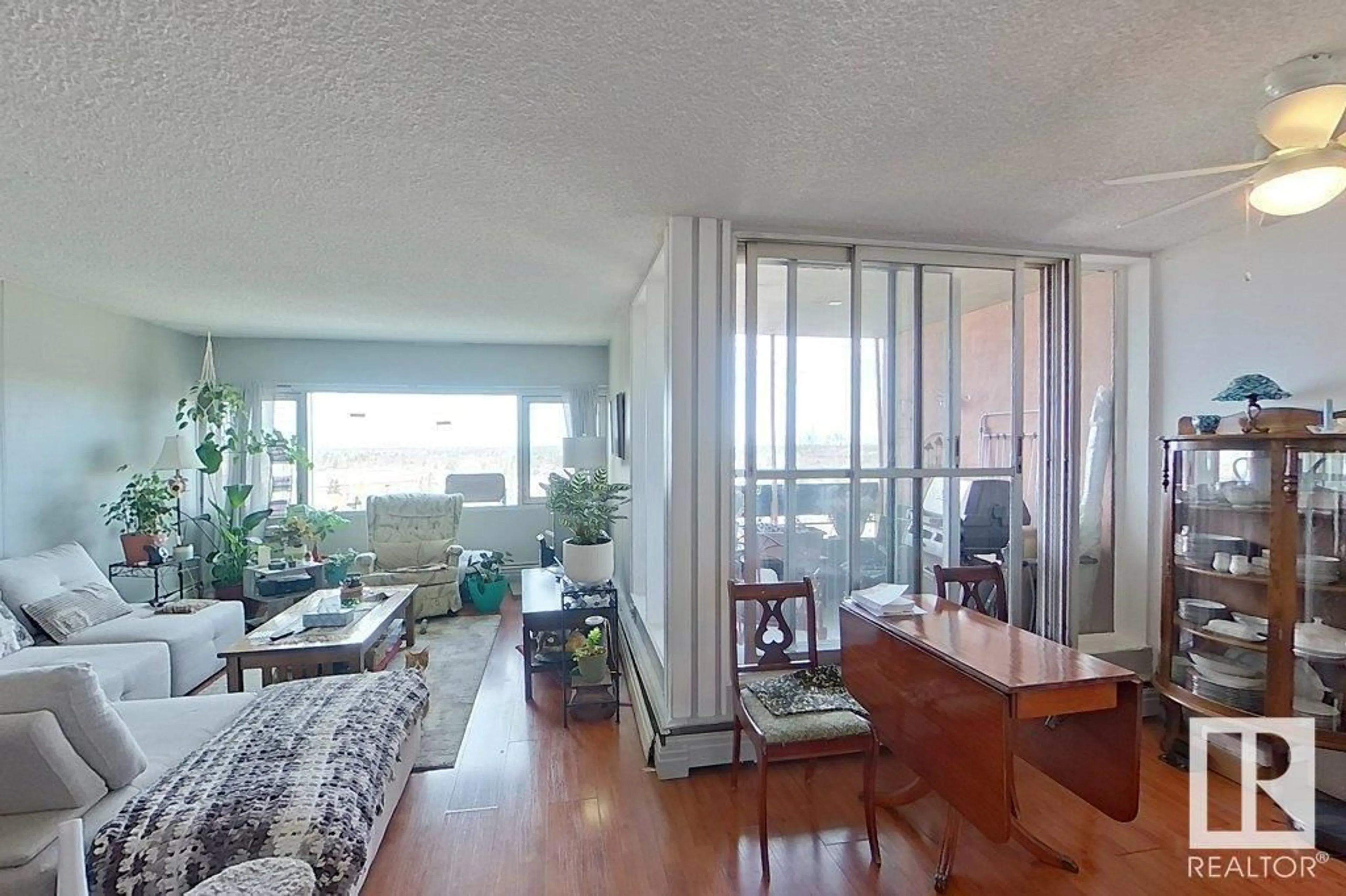Living room with furniture, wood/laminate floor for #111 - 8735 165 ST, Edmonton Alberta T5R2R6