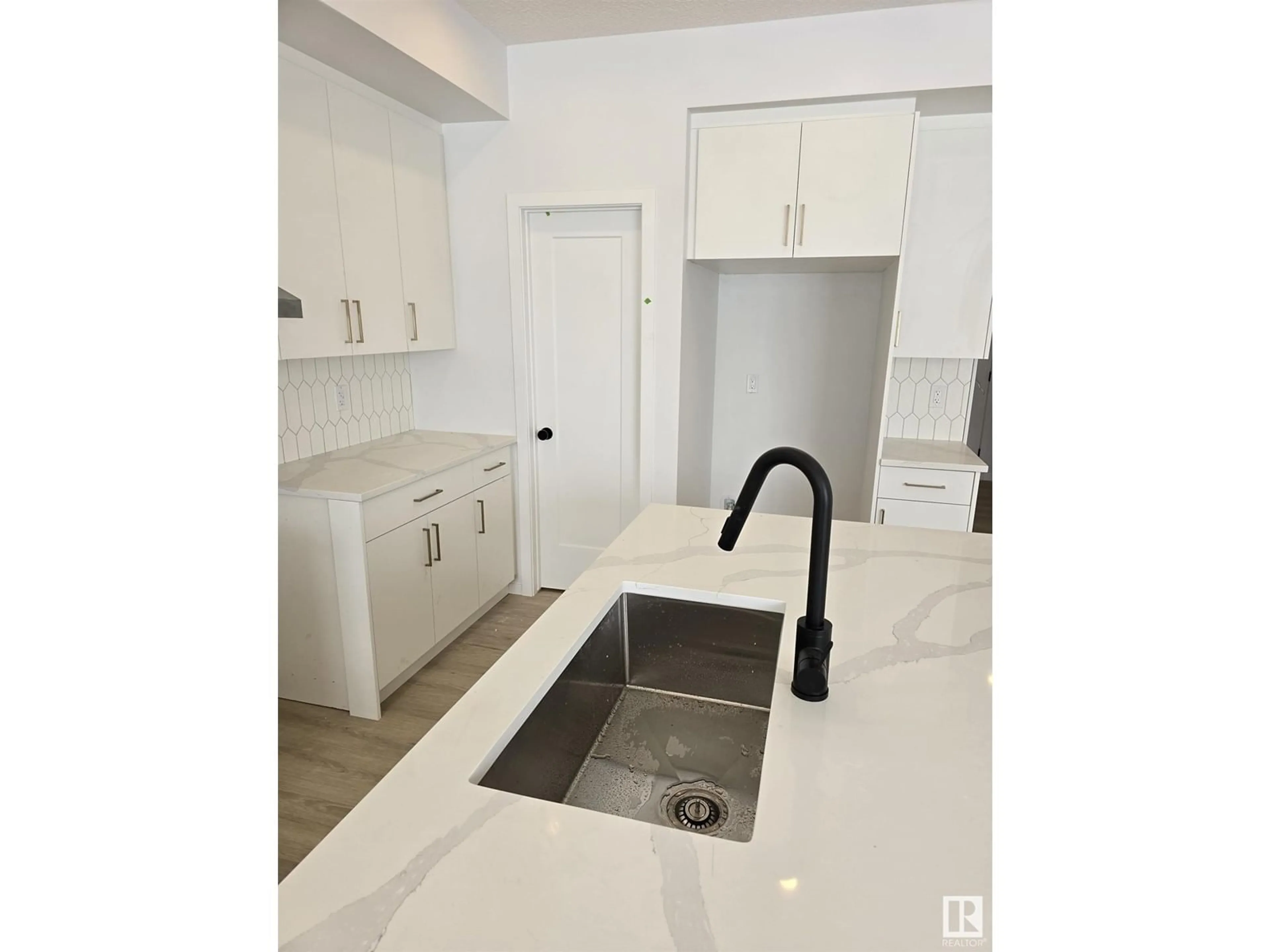 Standard kitchen, ceramic/tile floor for 7718 174A AV, Edmonton Alberta T5Z0W5