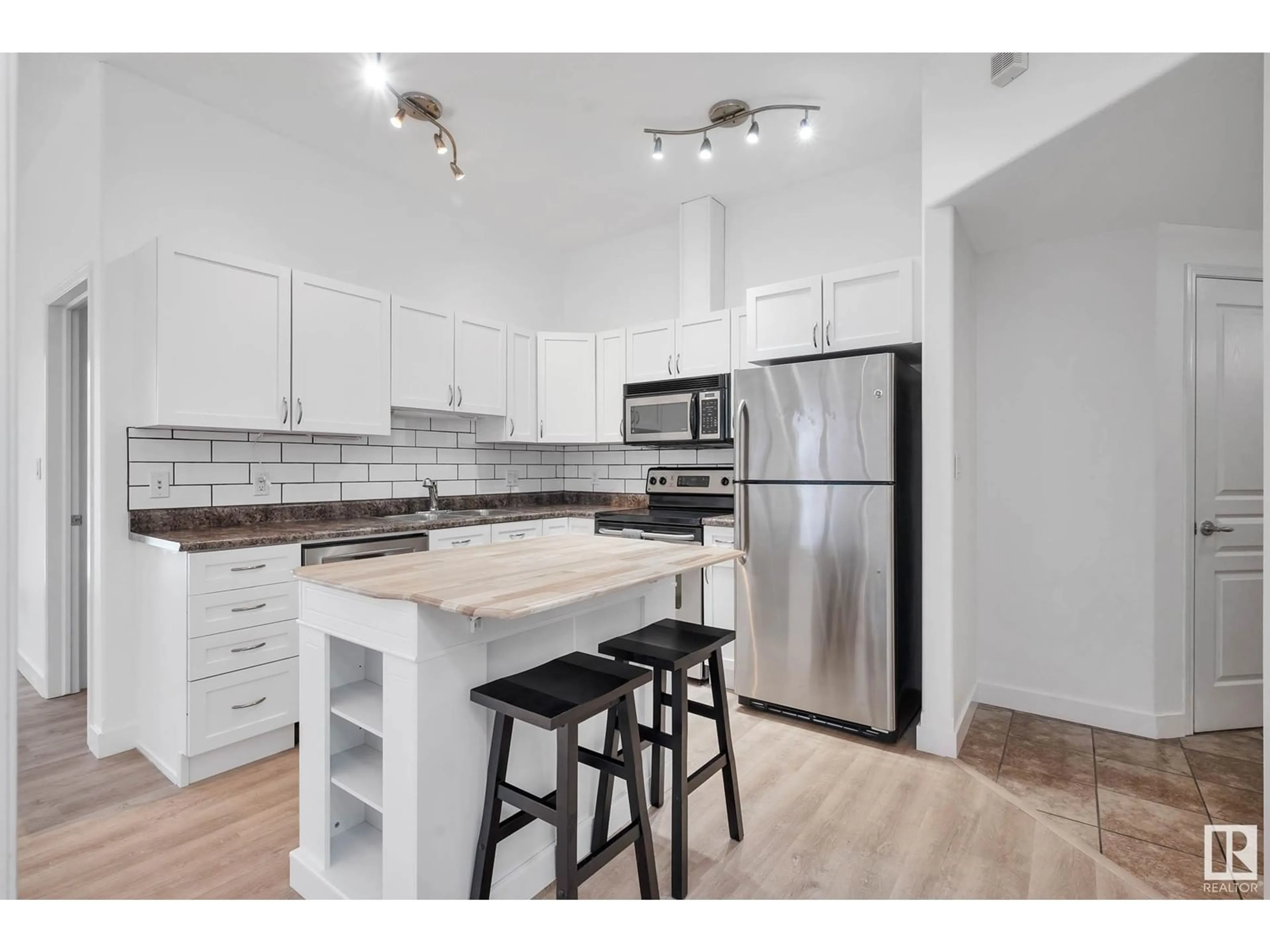 Open concept kitchen, unknown for #106 - 10319 111 ST NW, Edmonton Alberta T5K0A2