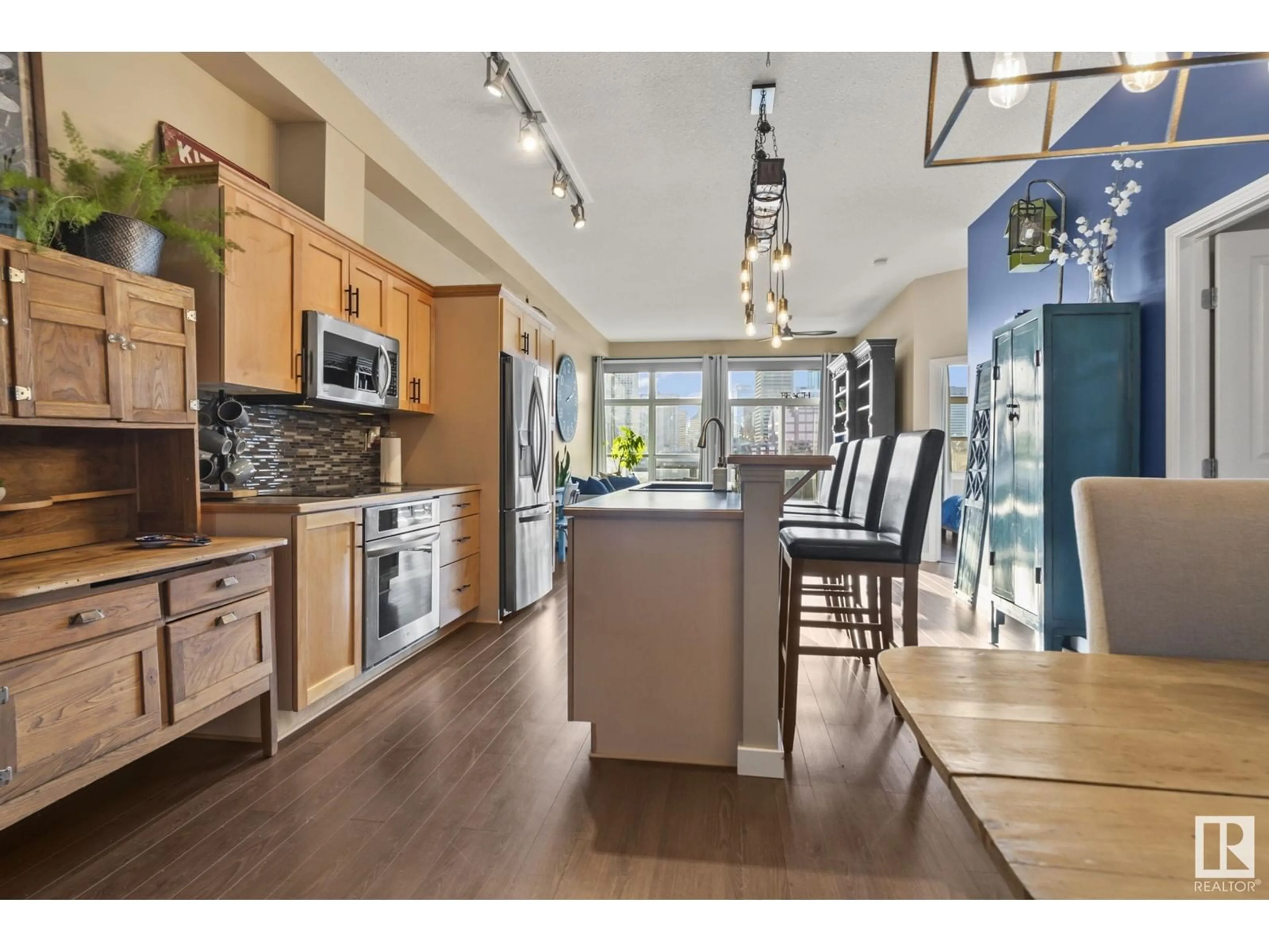 Open concept kitchen, wood/laminate floor for 411 - 9503 101 AV, Edmonton Alberta T5H4R1