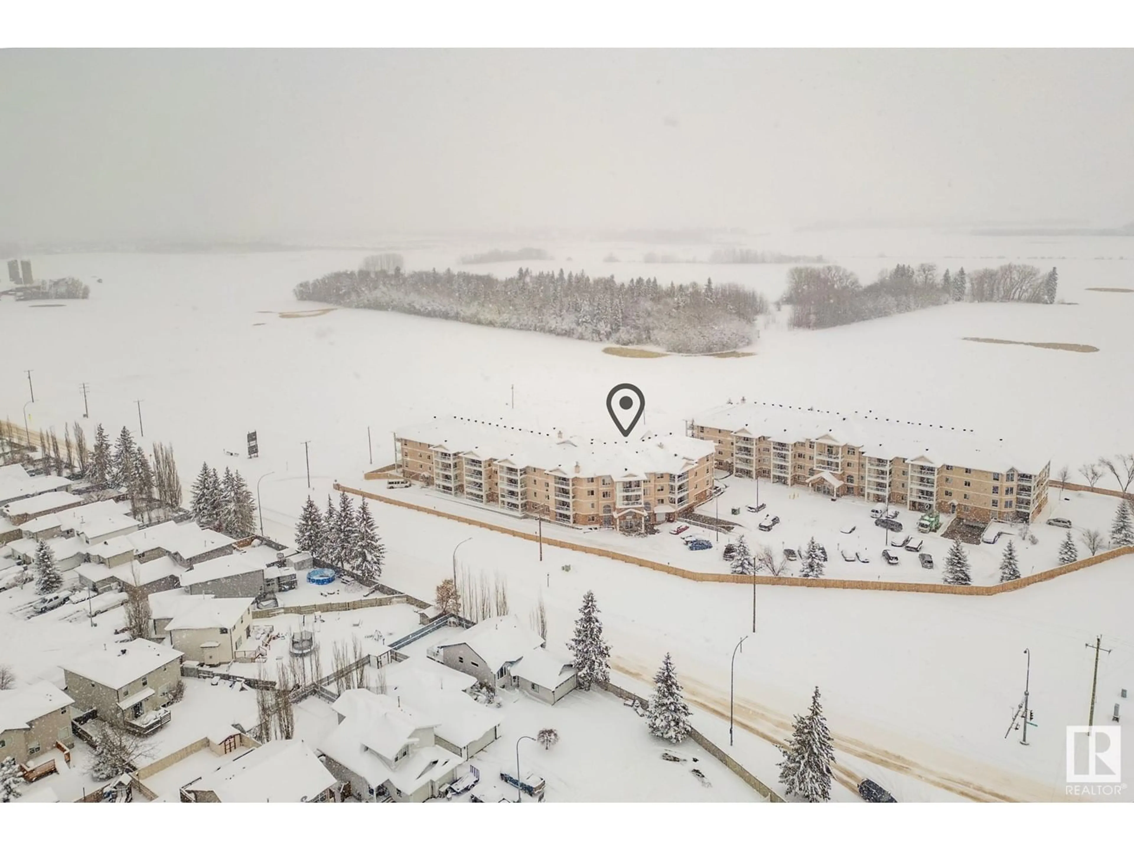 A pic from outside/outdoor area/front of a property/back of a property/a pic from drone, water/lake/river/ocean view for 423 7801 GOLF COURSE RD, Stony Plain Alberta T7Z0C7