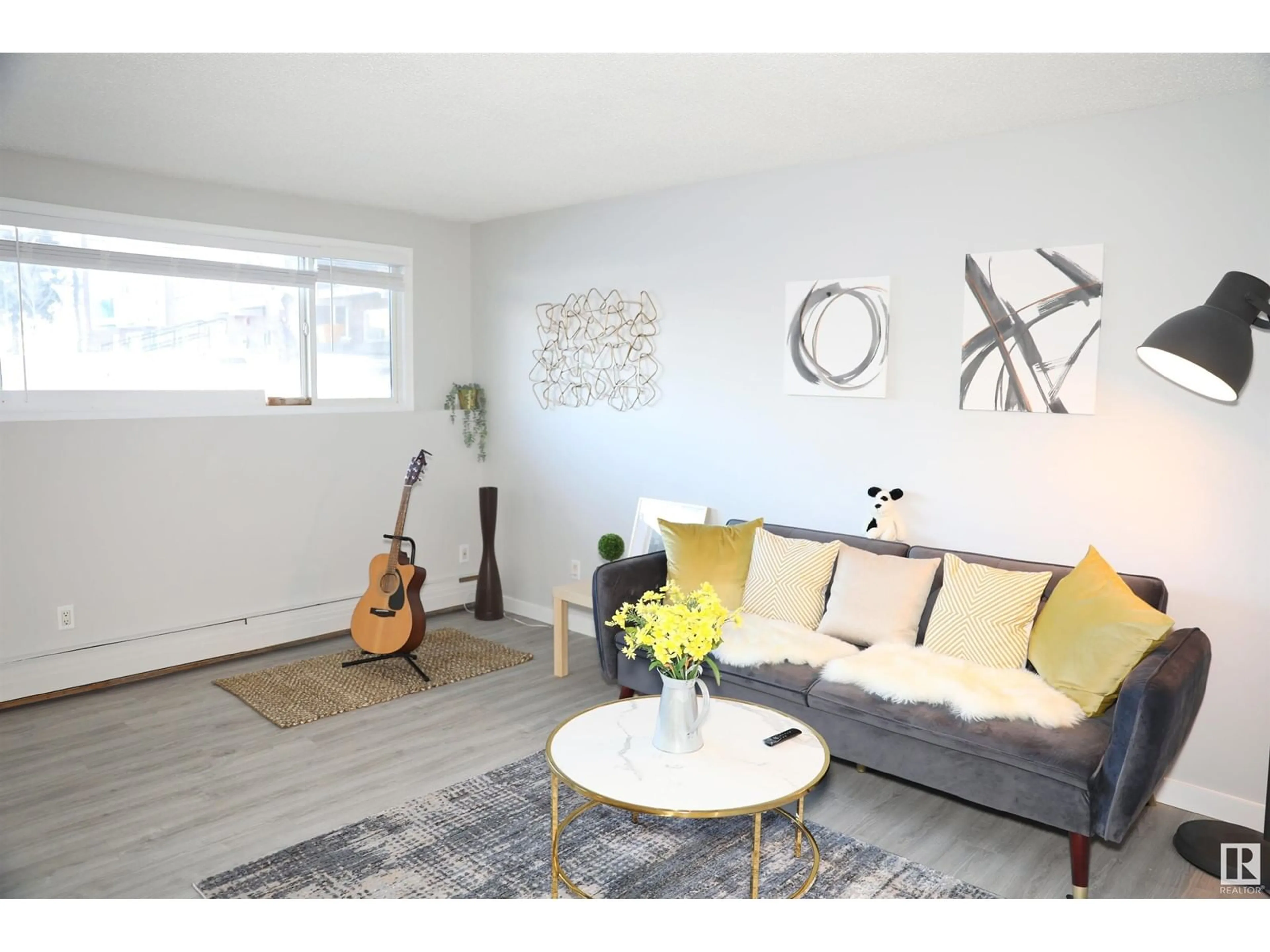 Living room with furniture, wood/laminate floor for 106 - 11465 41 AV, Edmonton Alberta T6J0T9