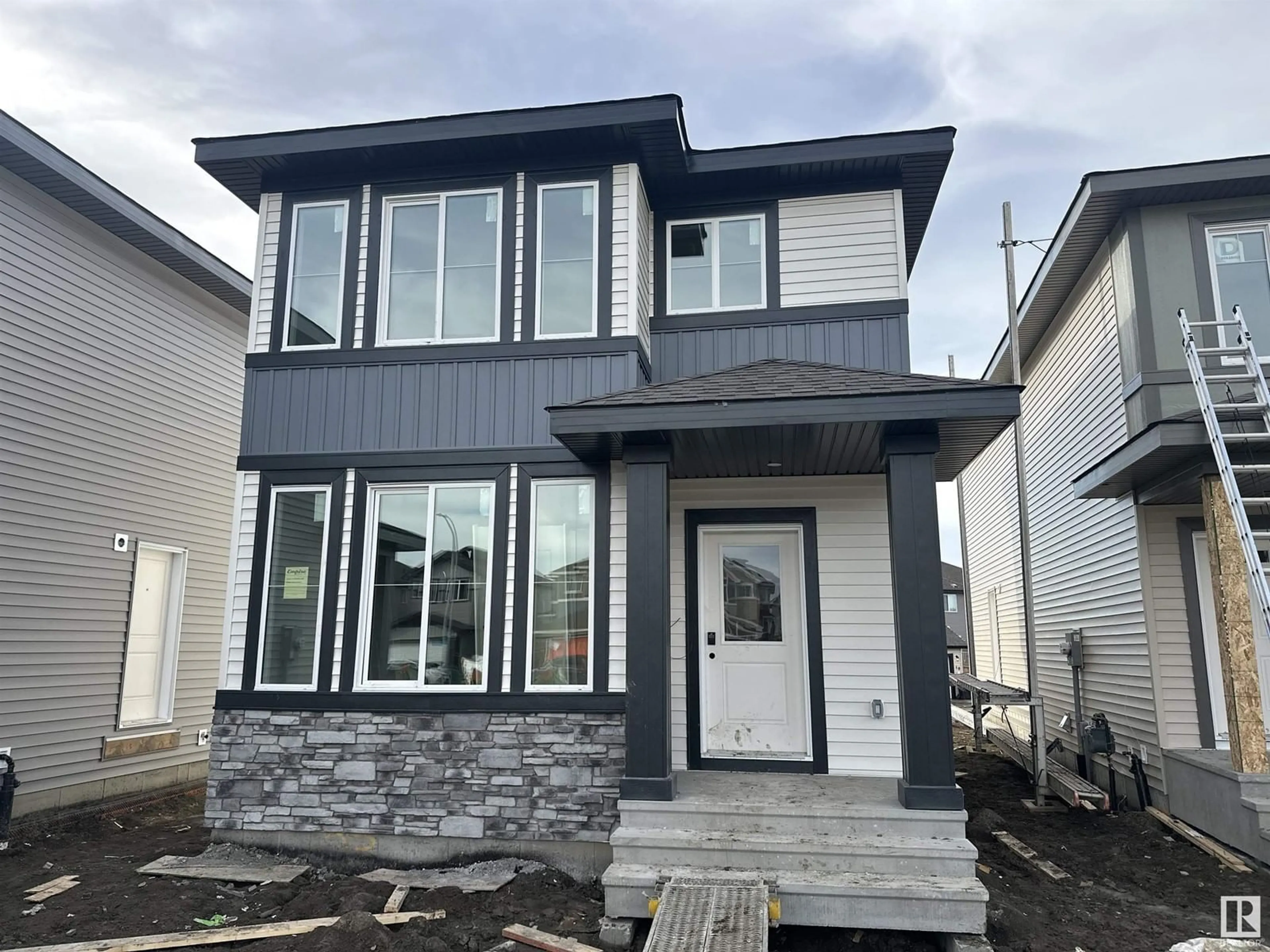 Home with vinyl exterior material, street for 23 SERENO LN, Fort Saskatchewan Alberta T8L0Z9