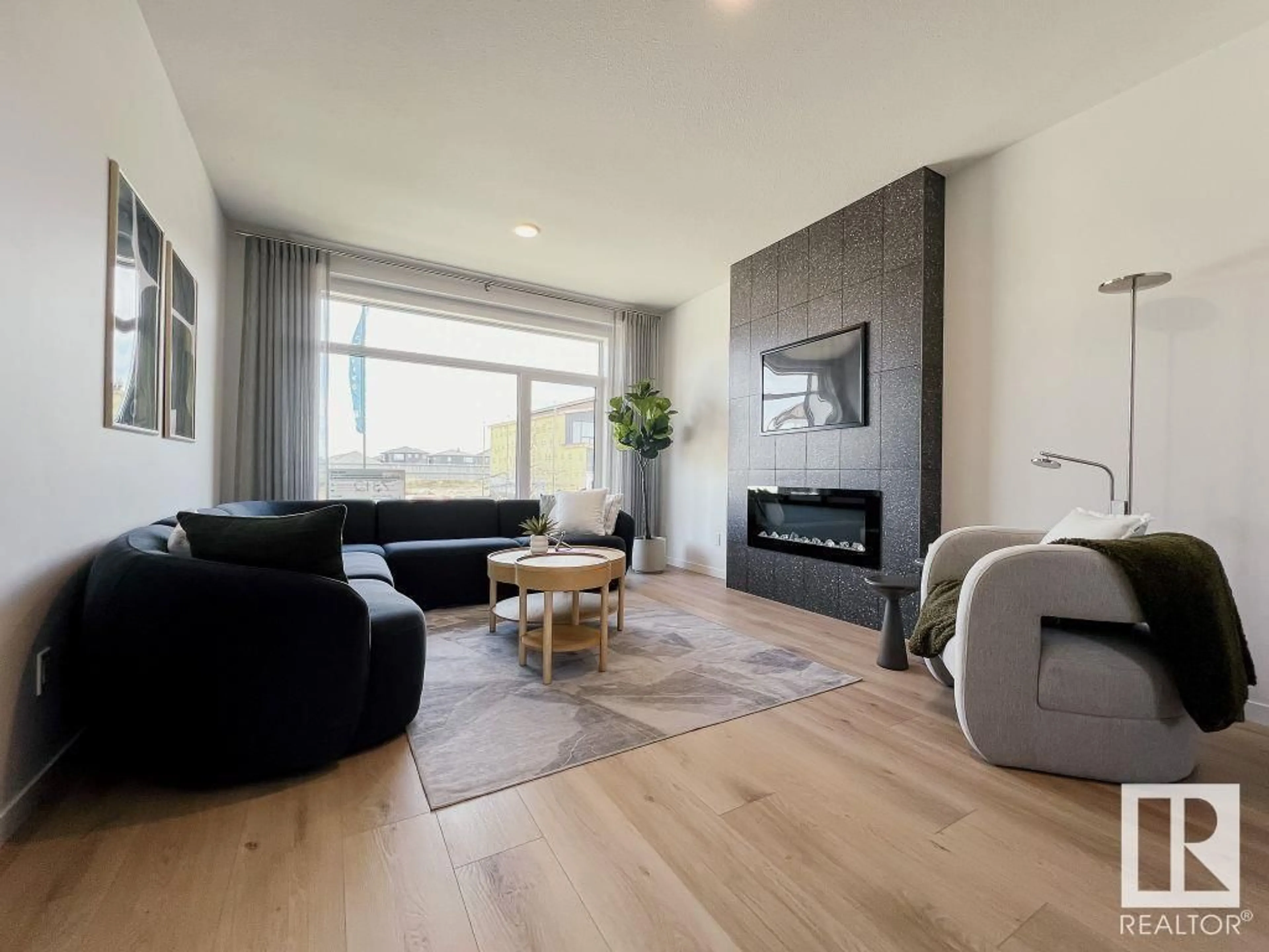 Living room with furniture, wood/laminate floor for 5100 PARC RUNIS WY, Beaumont Alberta T4X3E4