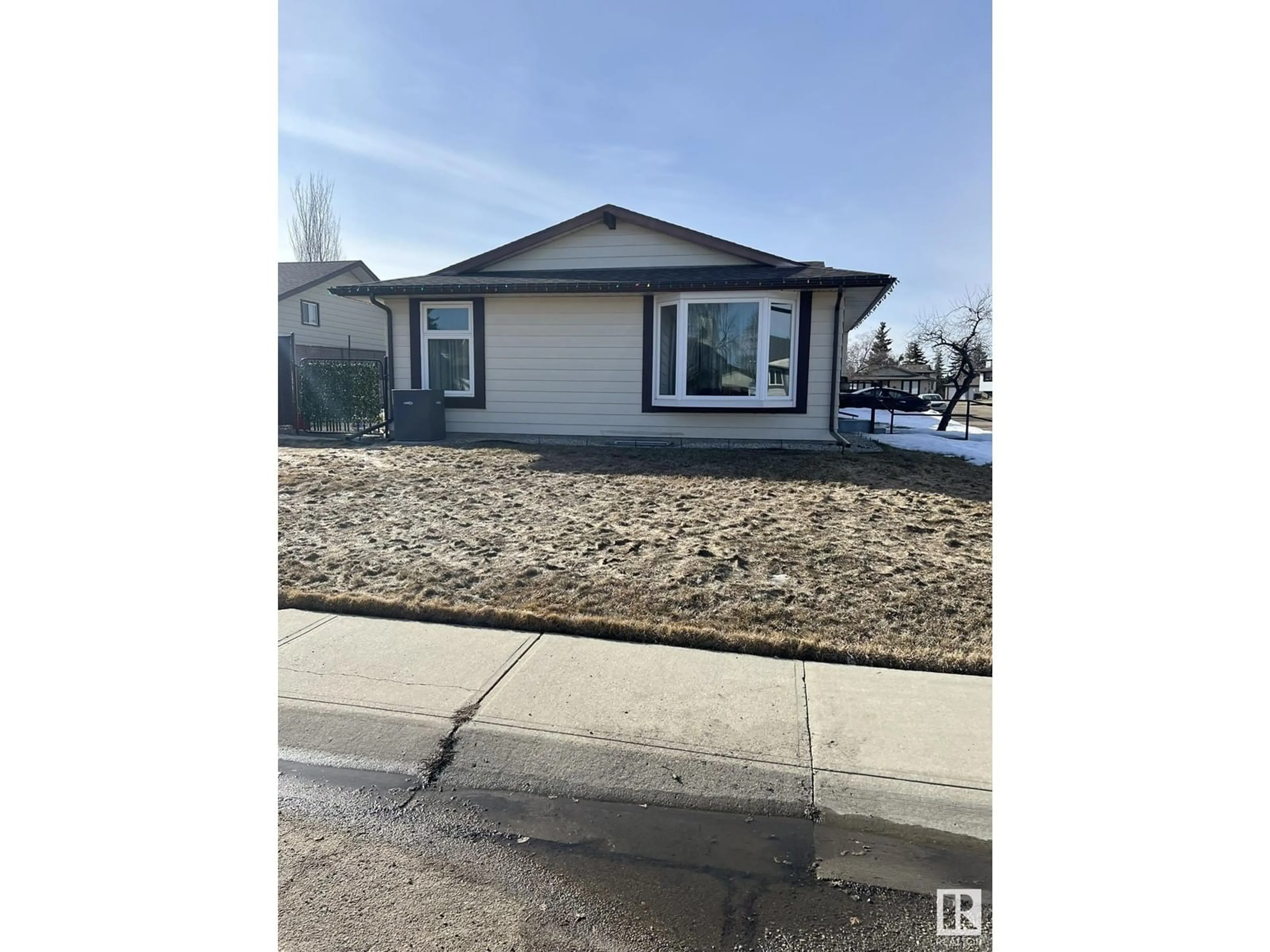 Home with vinyl exterior material, street for 14536 26 ST, Edmonton Alberta T5Y1W7