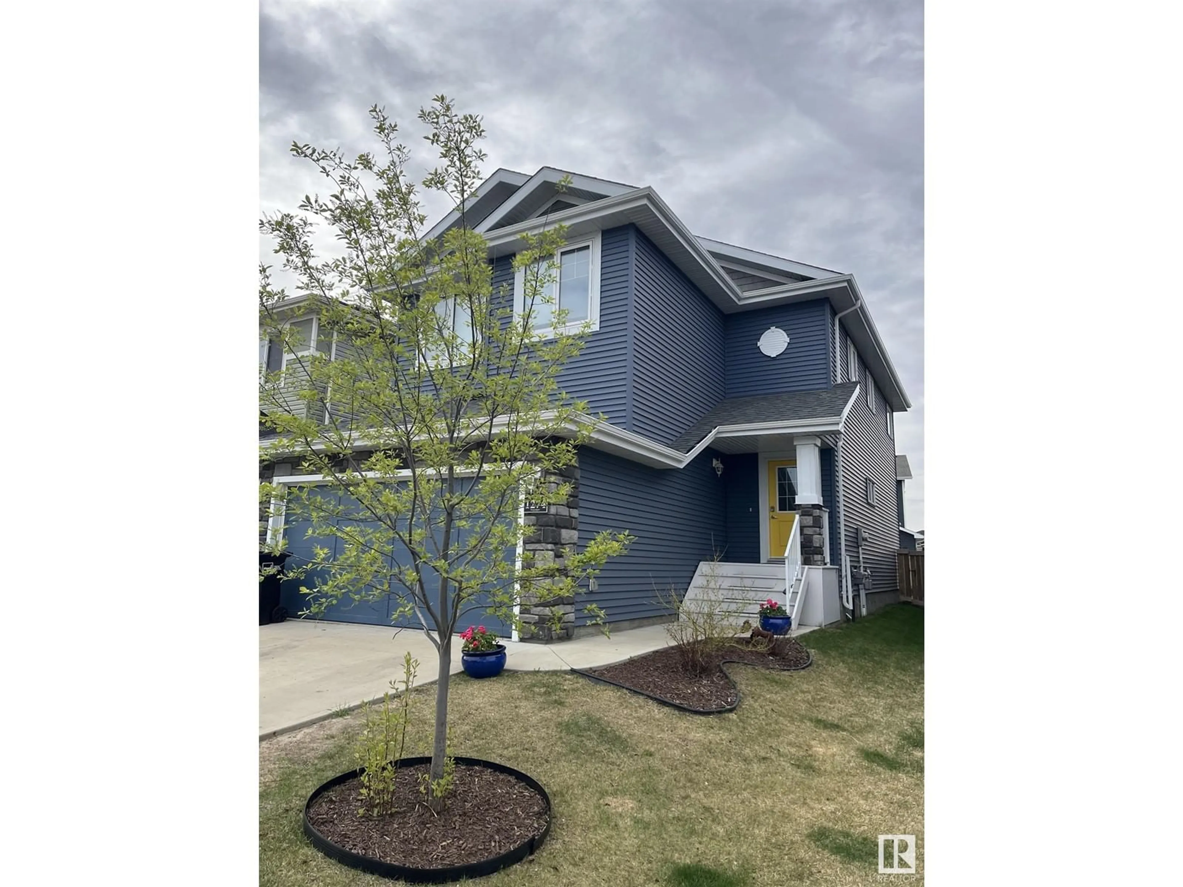 Home with vinyl exterior material, street for NW - 1274 PEREGRINE TC, Edmonton Alberta T5S0M4