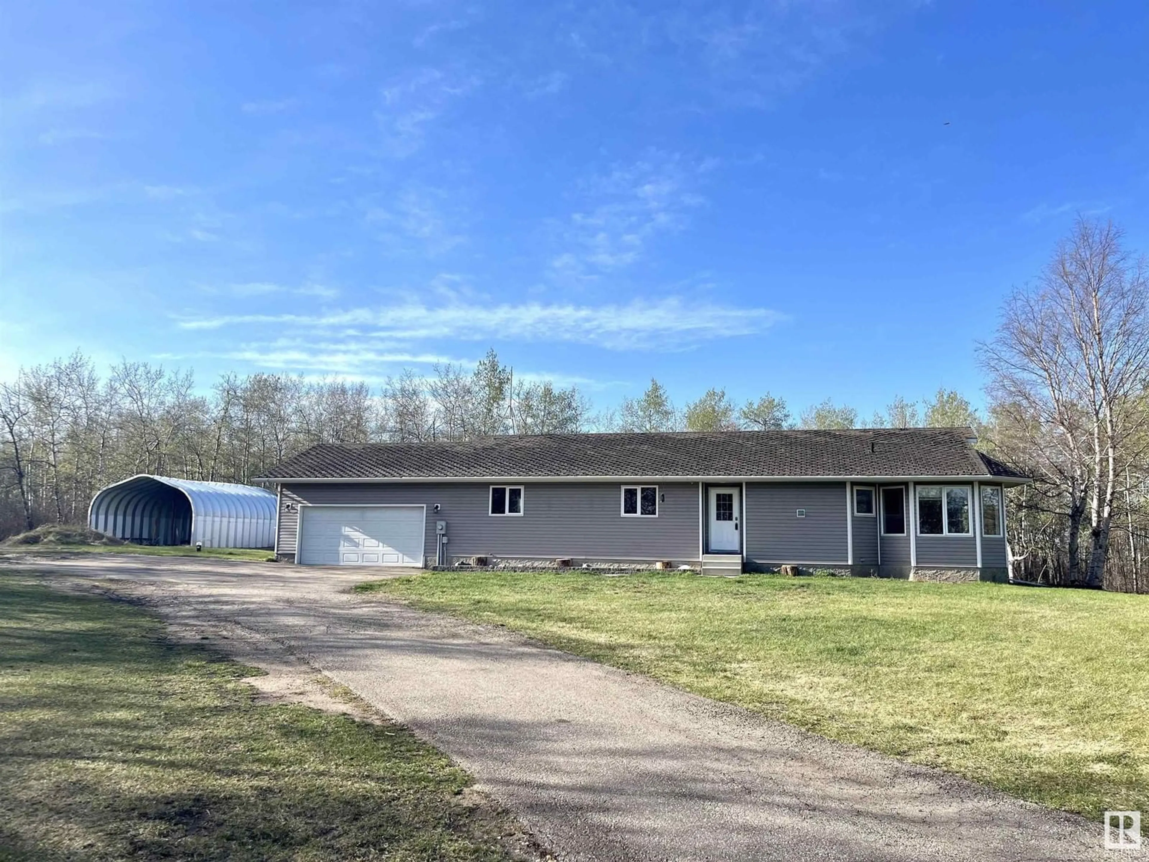 A pic from outside/outdoor area/front of a property/back of a property/a pic from drone, unknown for 39 - 57022 RGE RD 233, Rural Sturgeon County Alberta T0A1N5