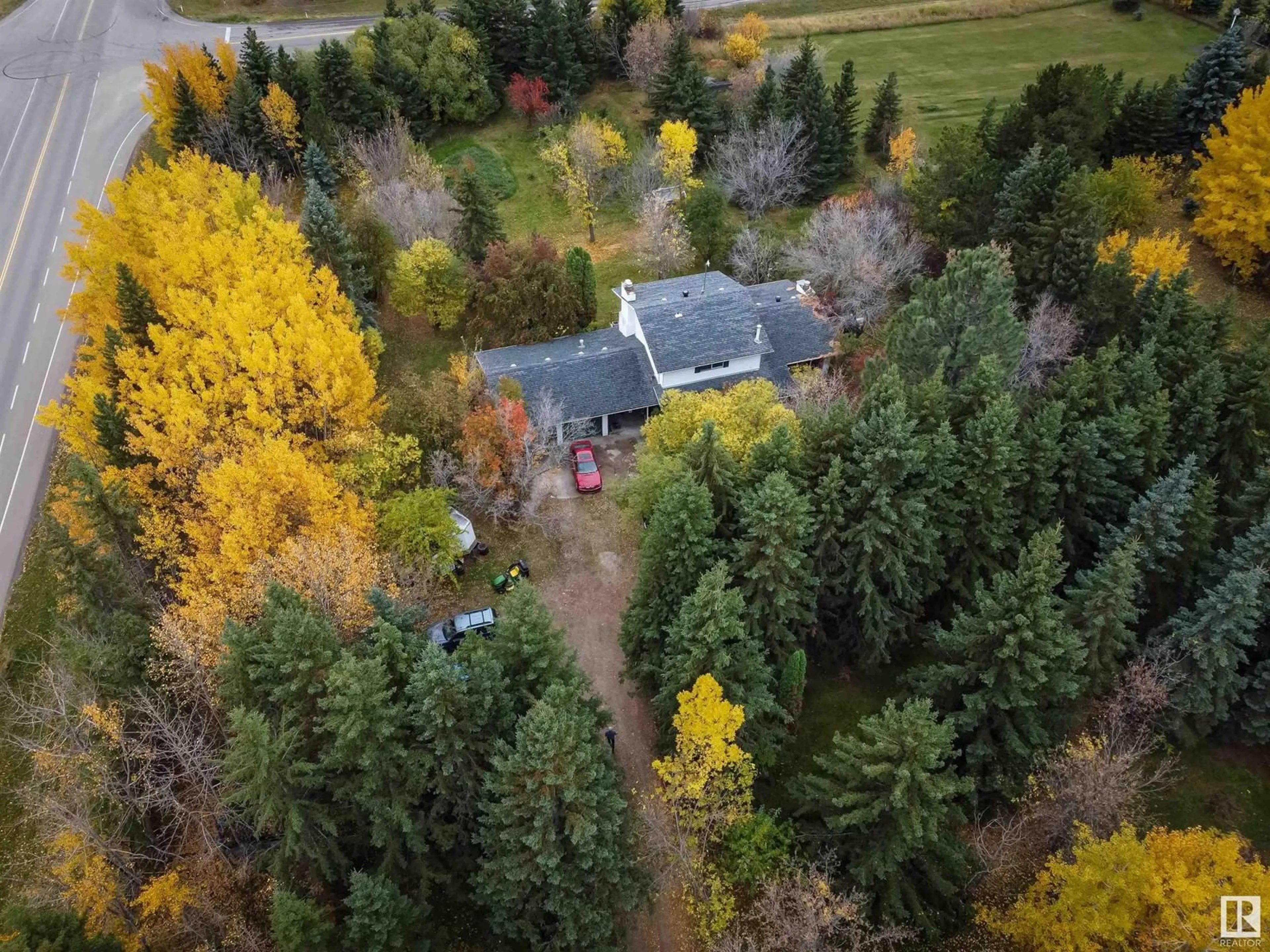 A pic from outside/outdoor area/front of a property/back of a property/a pic from drone, forest/trees view for 54006 RGE ROAD 274, Rural Parkland County Alberta T7X3S8