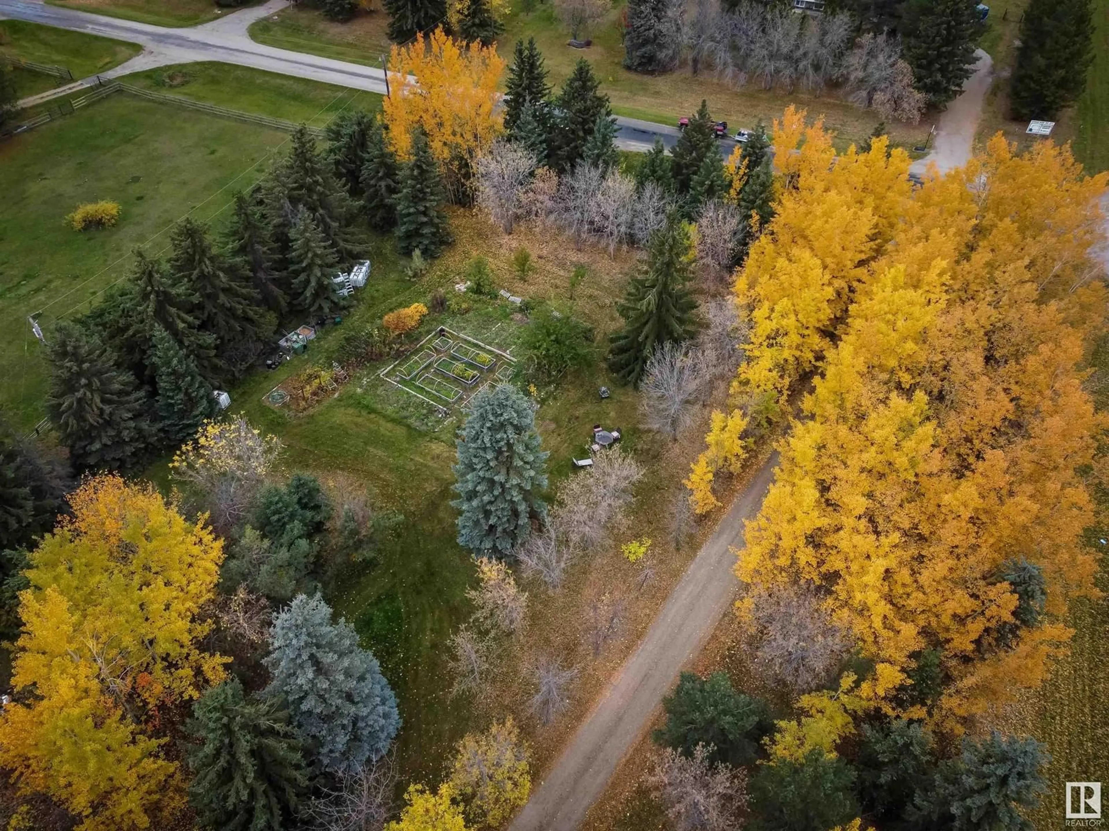 A pic from outside/outdoor area/front of a property/back of a property/a pic from drone, forest/trees view for 54006 RGE ROAD 274, Rural Parkland County Alberta T7X3S8