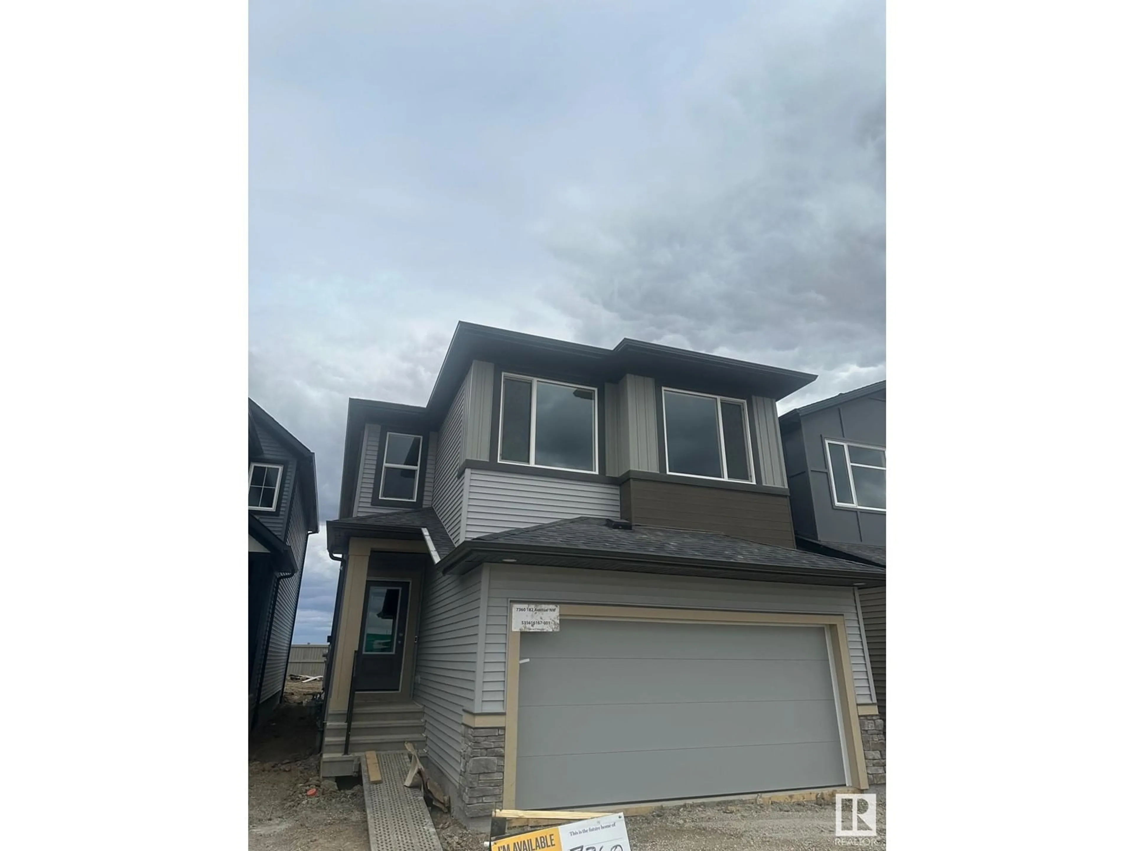 Home with vinyl exterior material, street for 7360 182 AV, Edmonton Alberta T5Z0L5