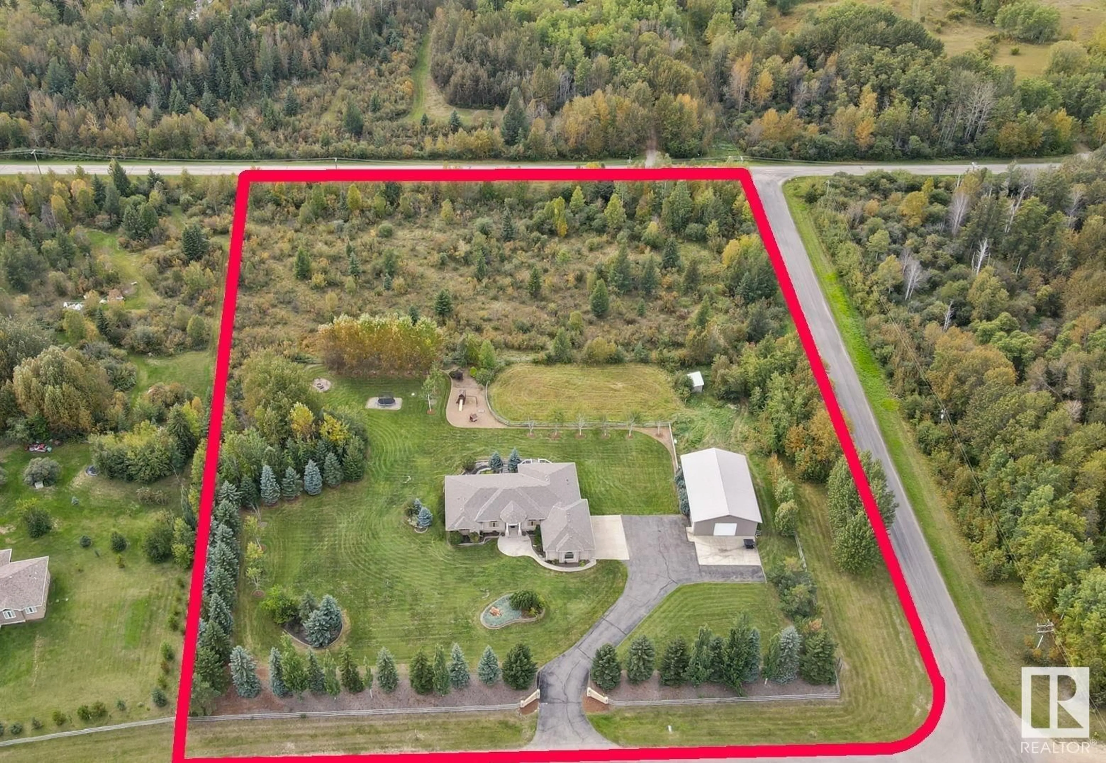 A pic from outside/outdoor area/front of a property/back of a property/a pic from drone, unknown for 26029 TWP RD 512, Rural Parkland County Alberta T7Y1B2
