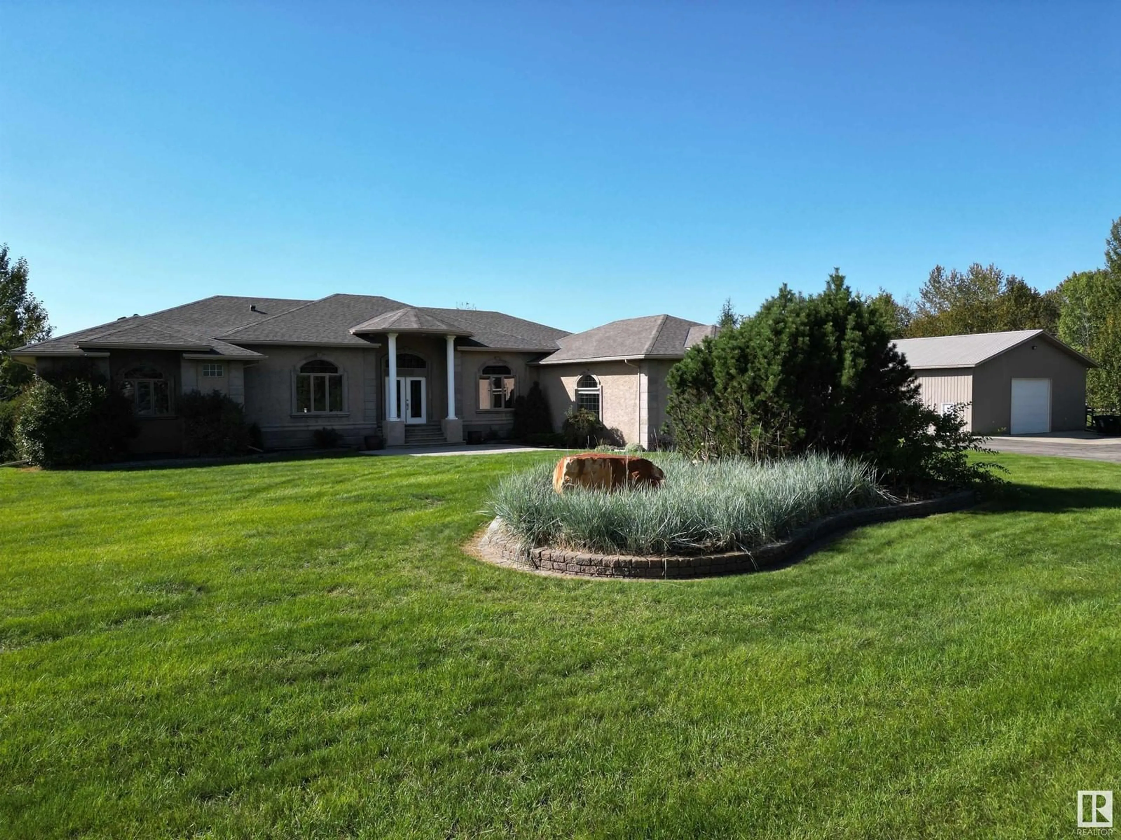 A pic from outside/outdoor area/front of a property/back of a property/a pic from drone, unknown for 26029 TWP RD 512, Rural Parkland County Alberta T7Y1B2