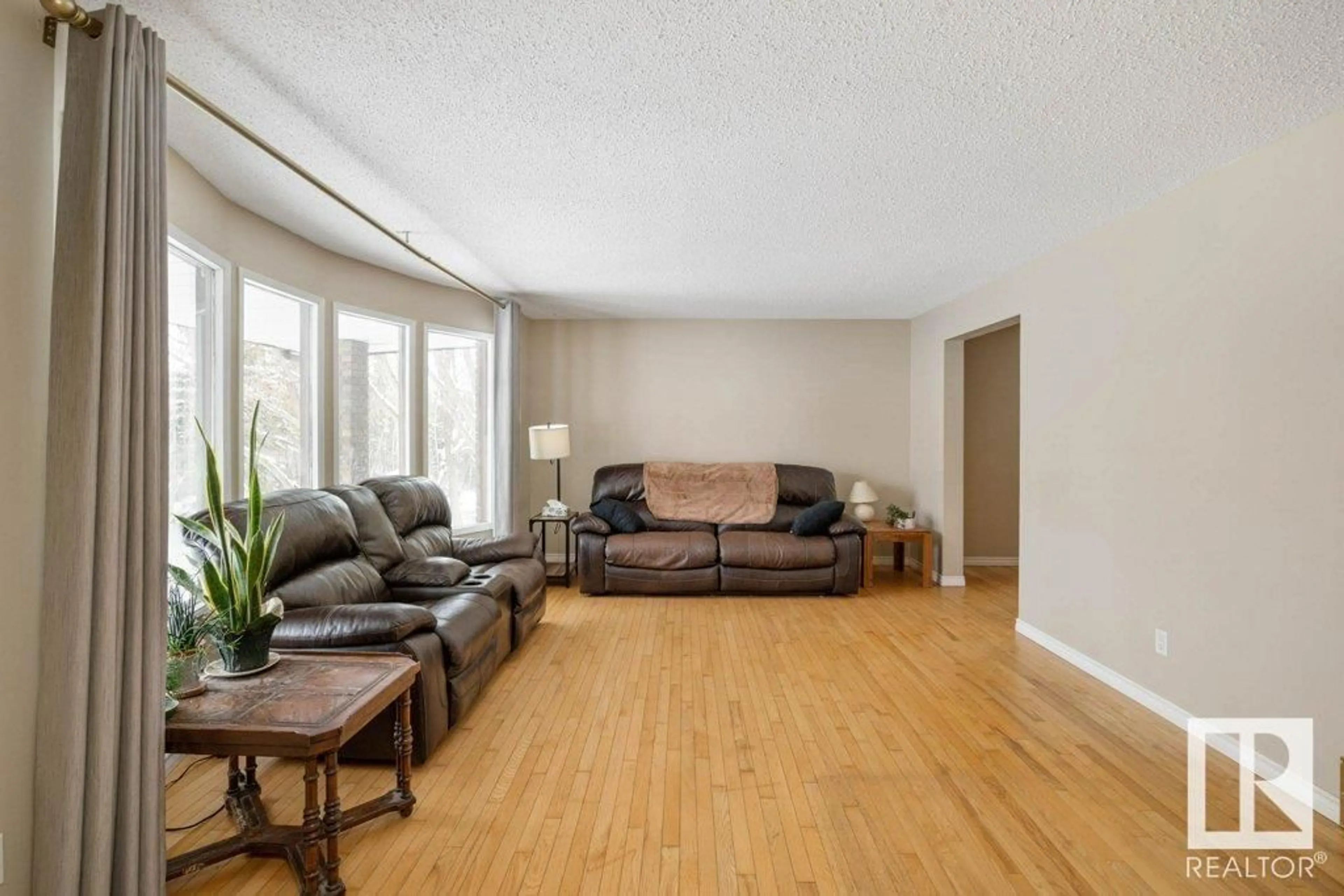 Living room with furniture, wood/laminate floor for 70 56019 RANGE ROAD 230, Rural Sturgeon County Alberta T0A1N2