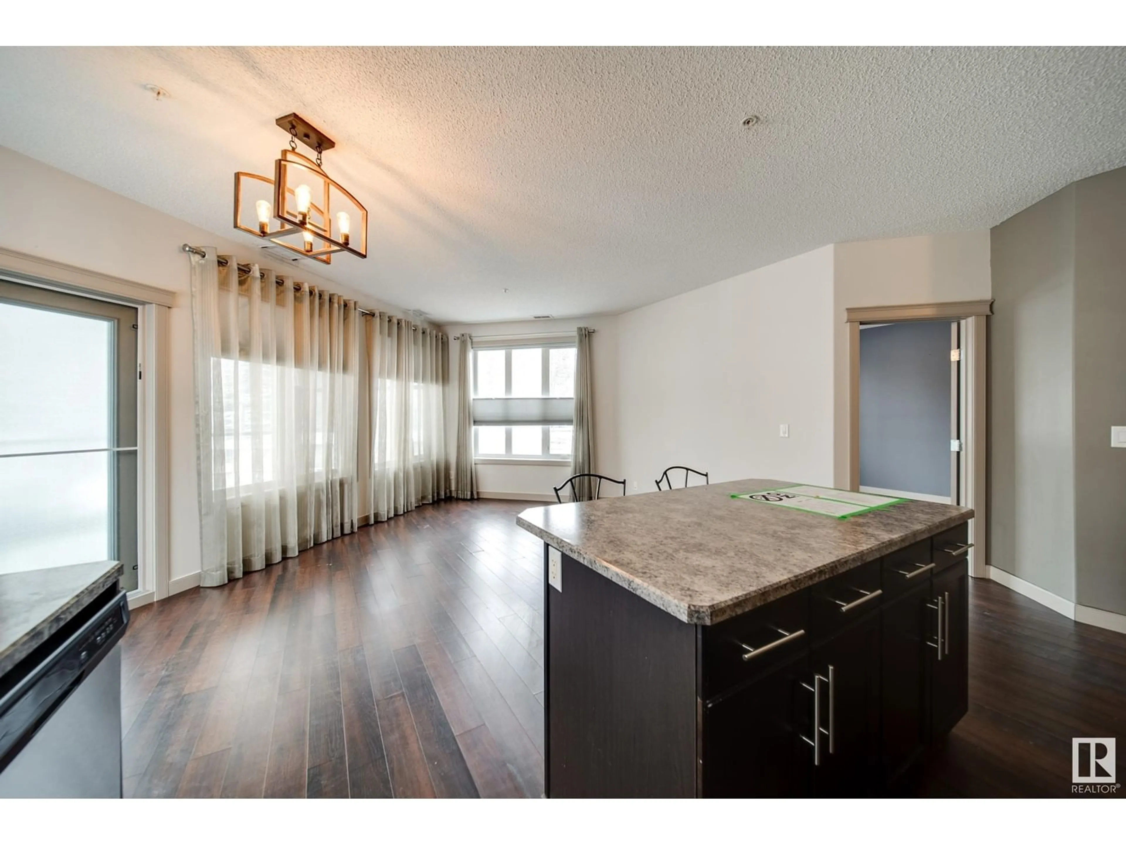 Open concept kitchen, wood/laminate floor for #123 - 4075 CLOVER BAR RD, Sherwood Park Alberta T8H0R6