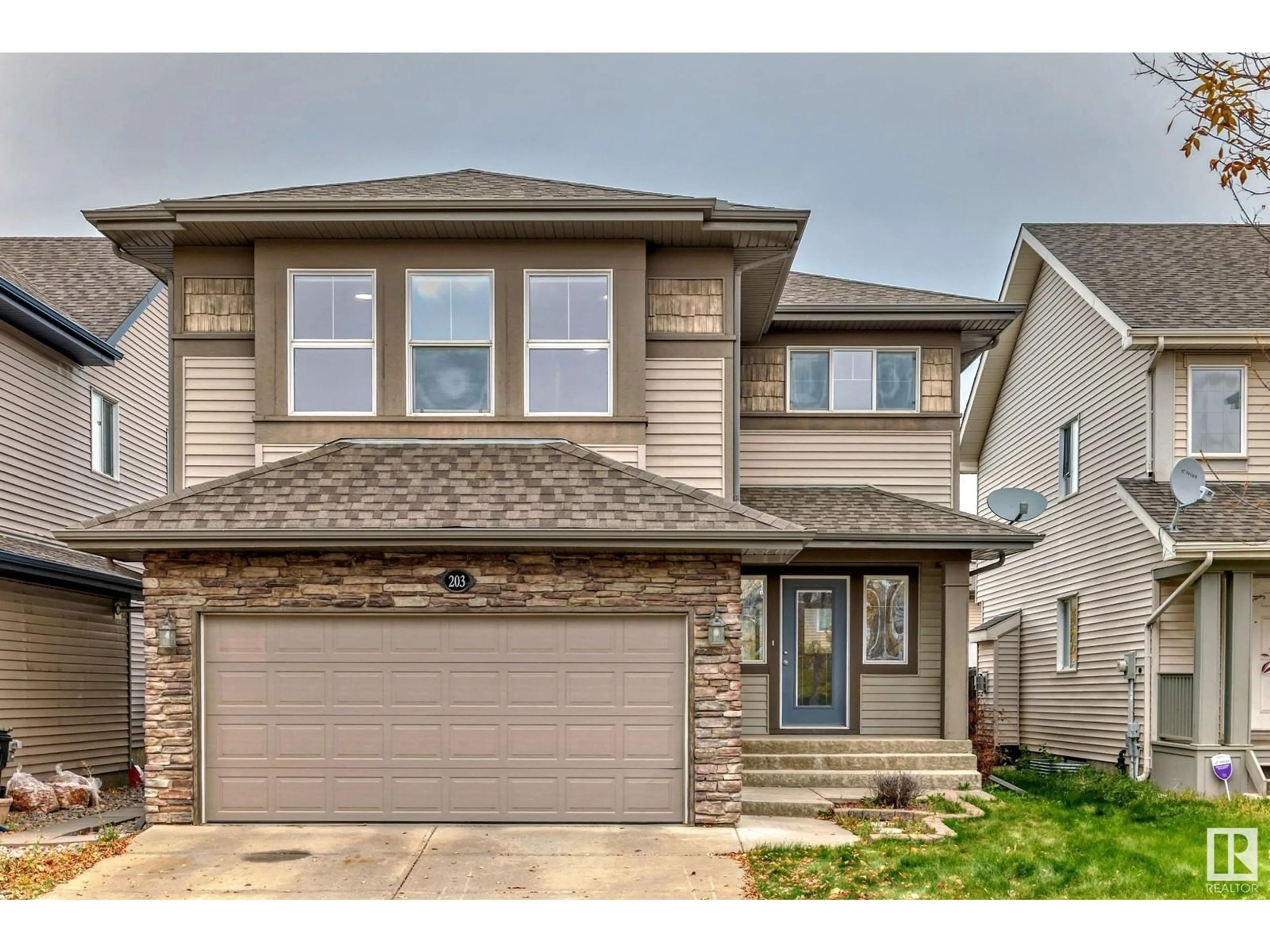 Home with vinyl exterior material, street for 203 CALDWELL WY, Edmonton Alberta T6M2X2