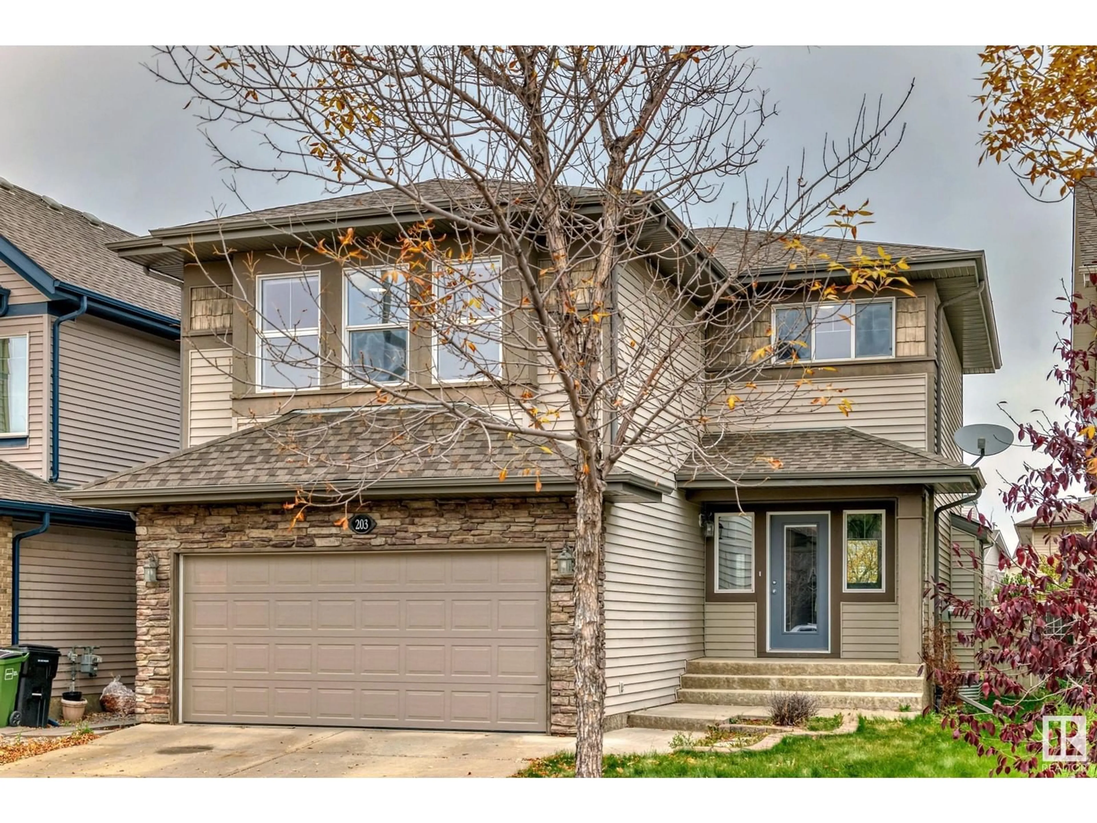 Home with vinyl exterior material, street for 203 CALDWELL WY, Edmonton Alberta T6M2X2