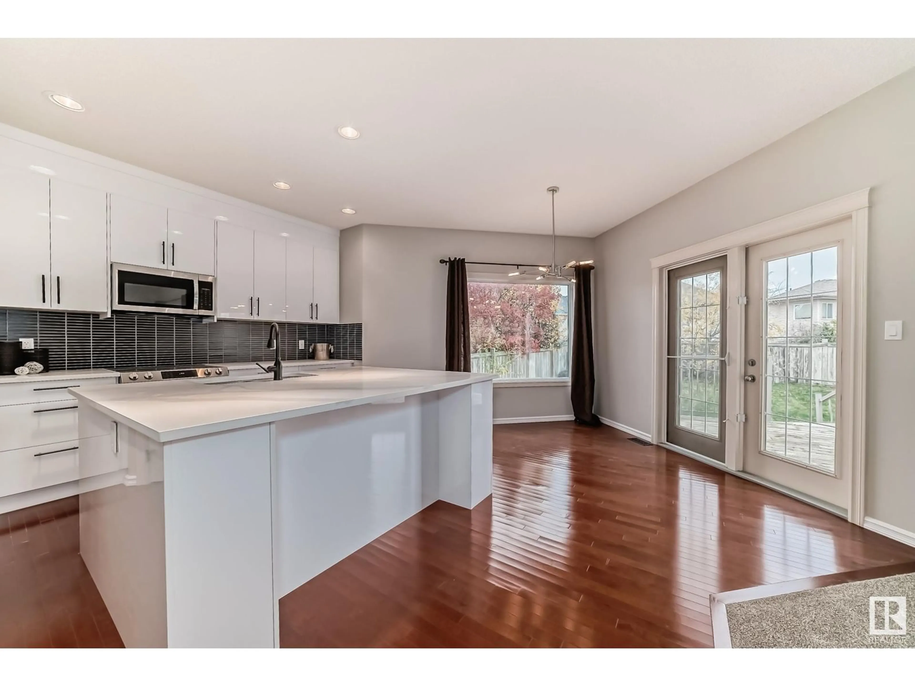 Open concept kitchen, wood/laminate floor for 203 CALDWELL WY, Edmonton Alberta T6M2X2