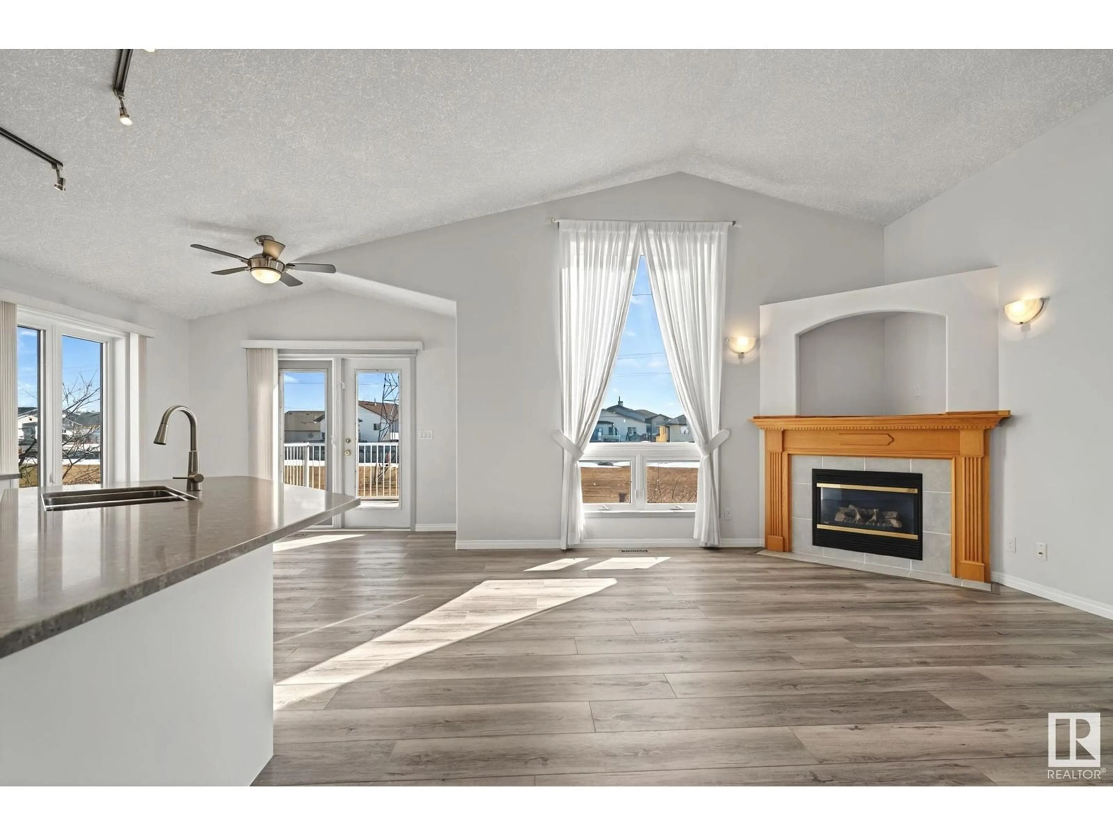 Open concept kitchen, wood/laminate floor for NW - 7819 164 AV, Edmonton Alberta T5Z3J7
