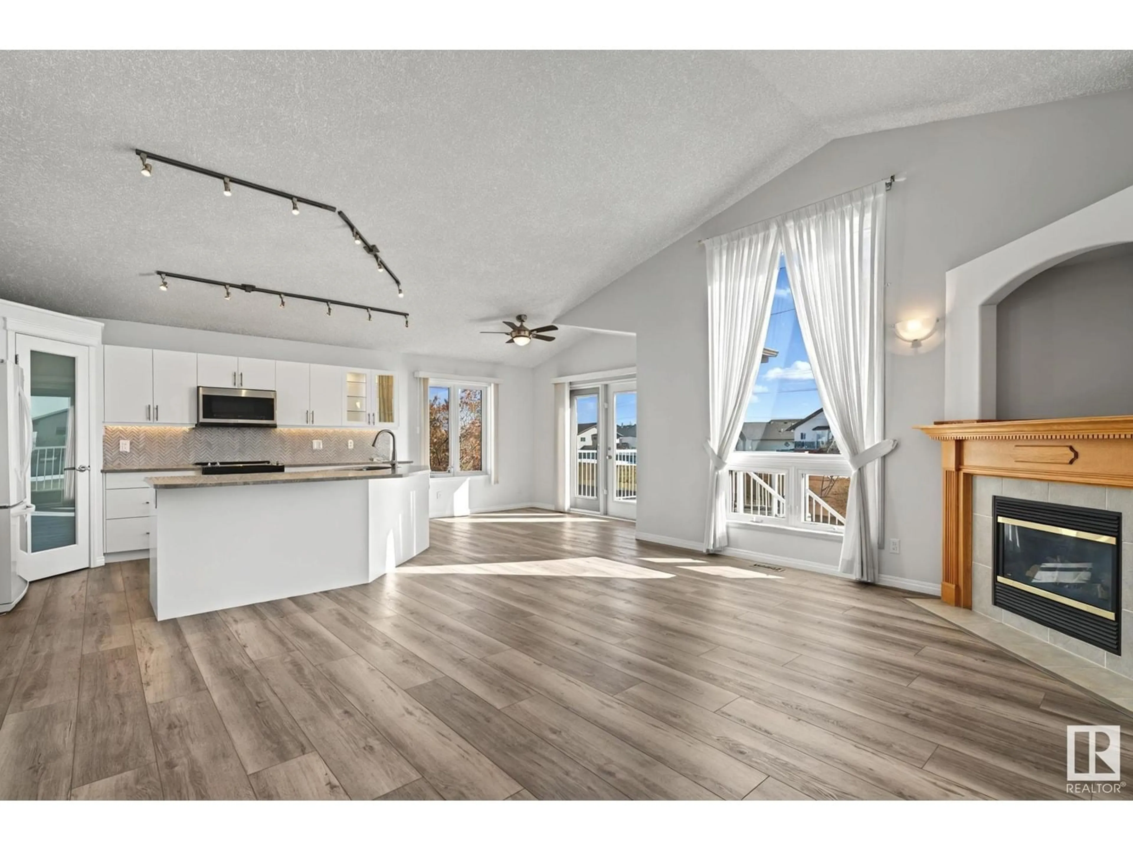 Open concept kitchen, wood/laminate floor for NW - 7819 164 AV, Edmonton Alberta T5Z3J7